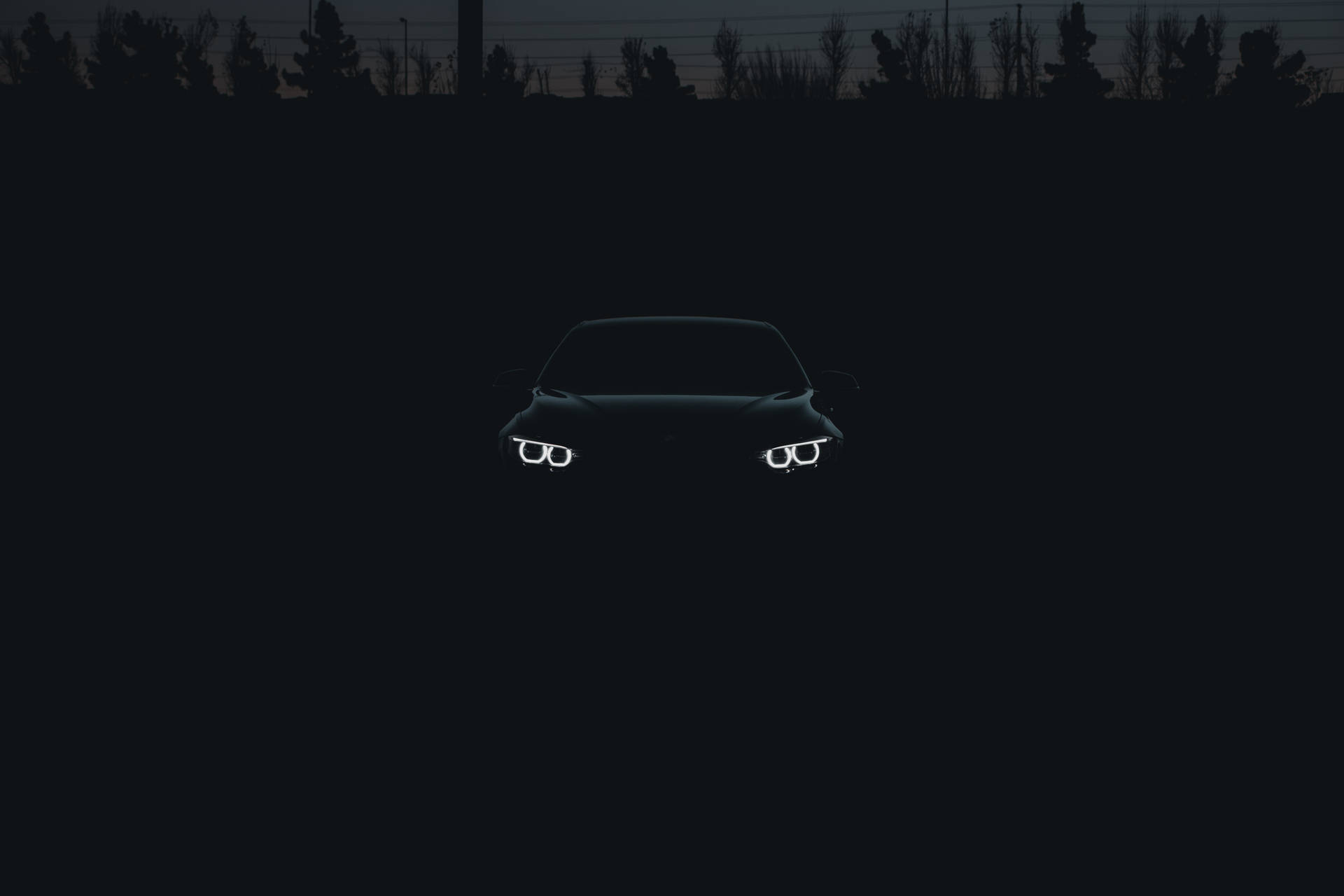 Download Black Bmw Car In The Shadows Wallpaper