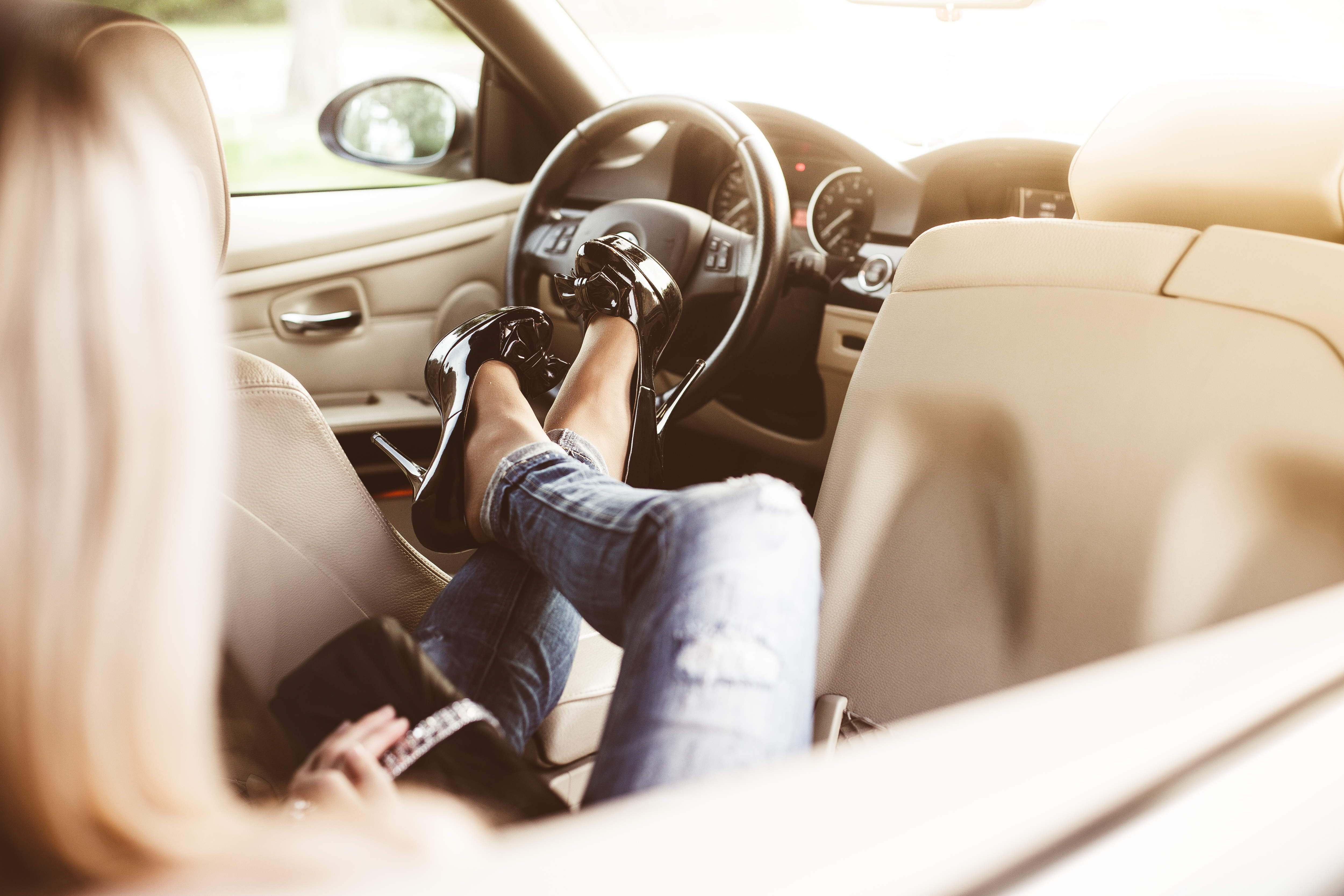 Young Woman in Luxury Car Transport Limousine Service Free