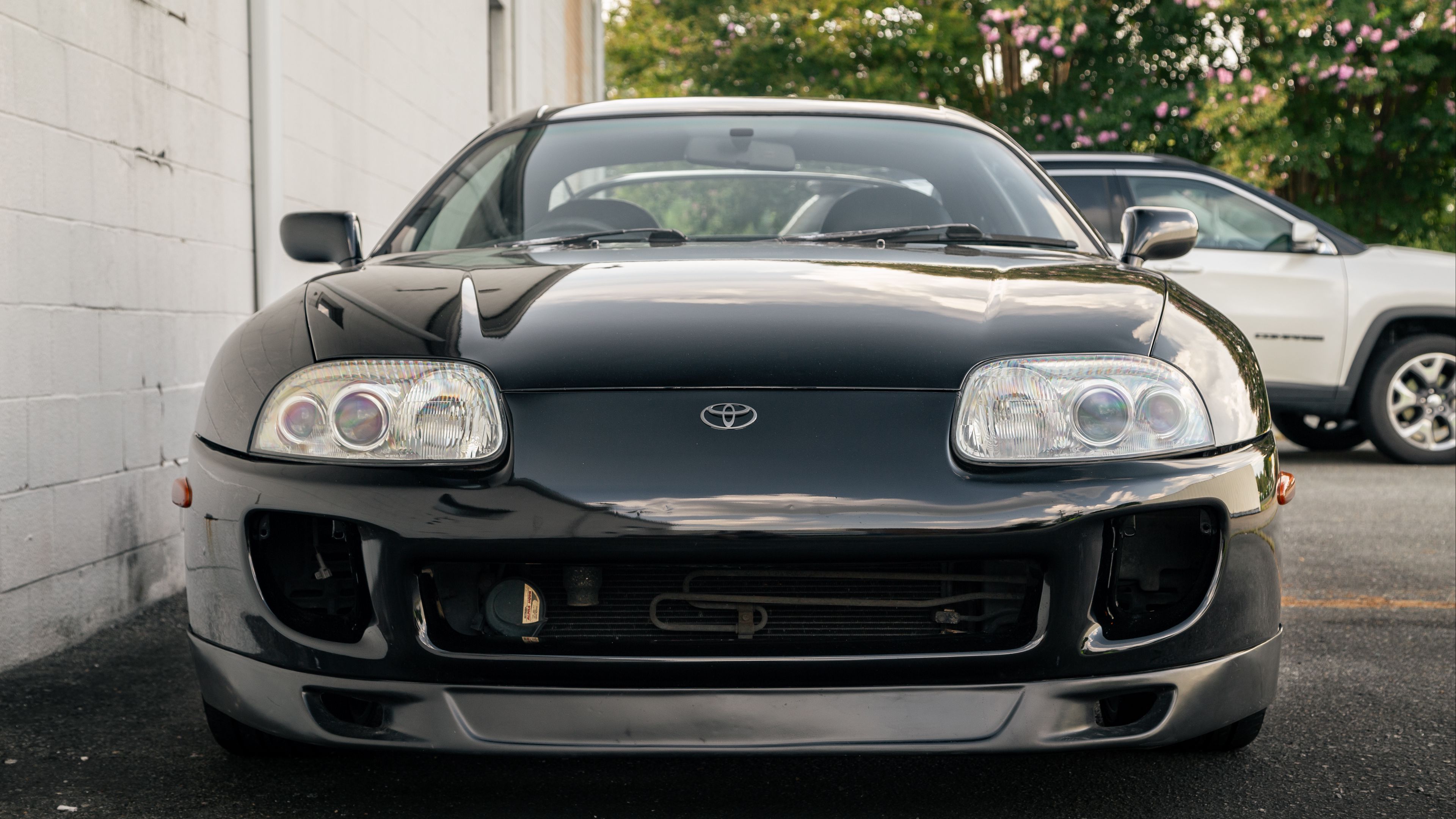 Download wallpaper 3840x2160 toyota supra, toyota, car, black, front view 4k uhd 16:9 HD background