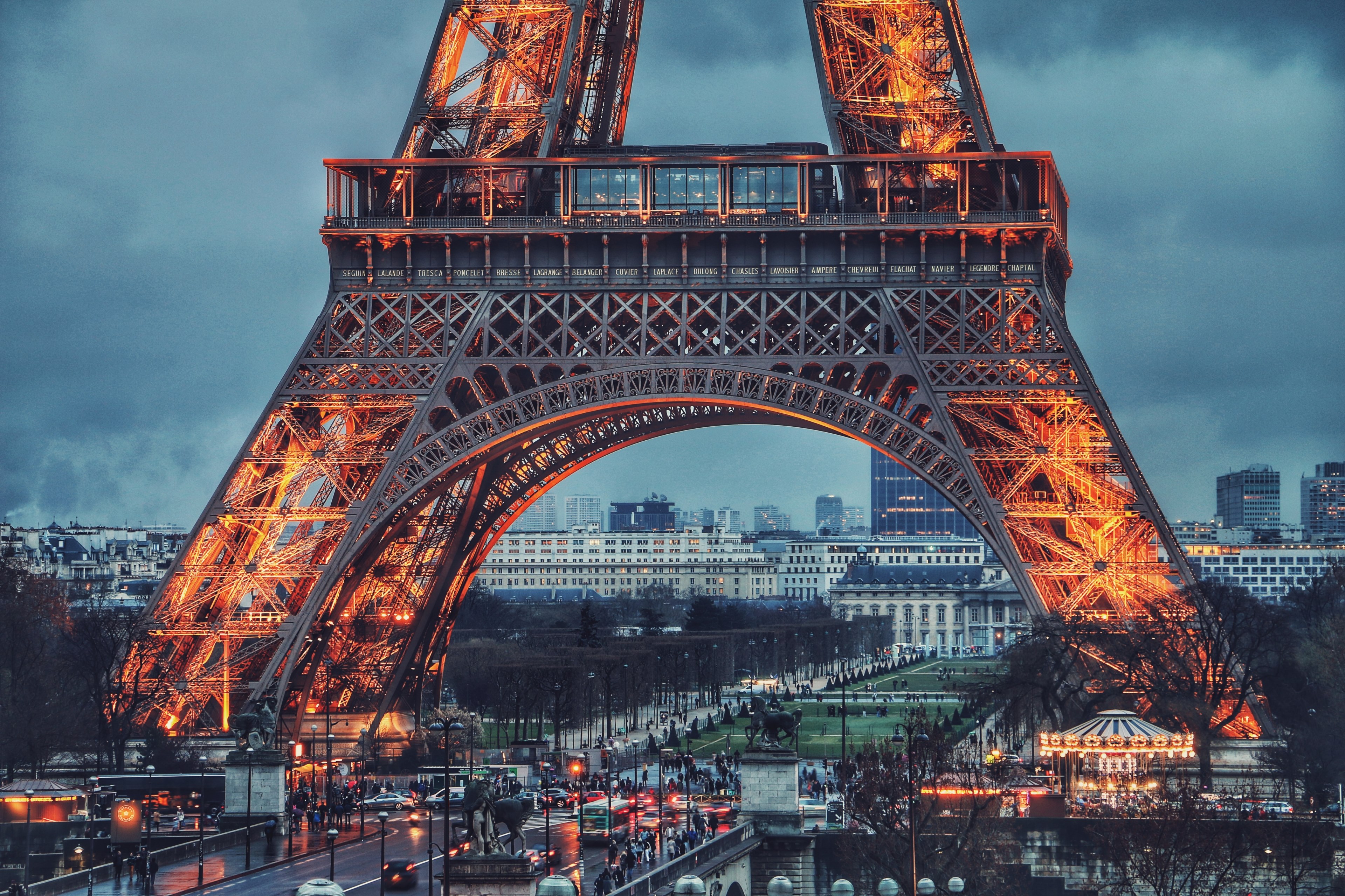 Wallpaper / the landmark eiffel tower in paris france illuminated at night, _yellowish eiffel 4k wallpaper free download
