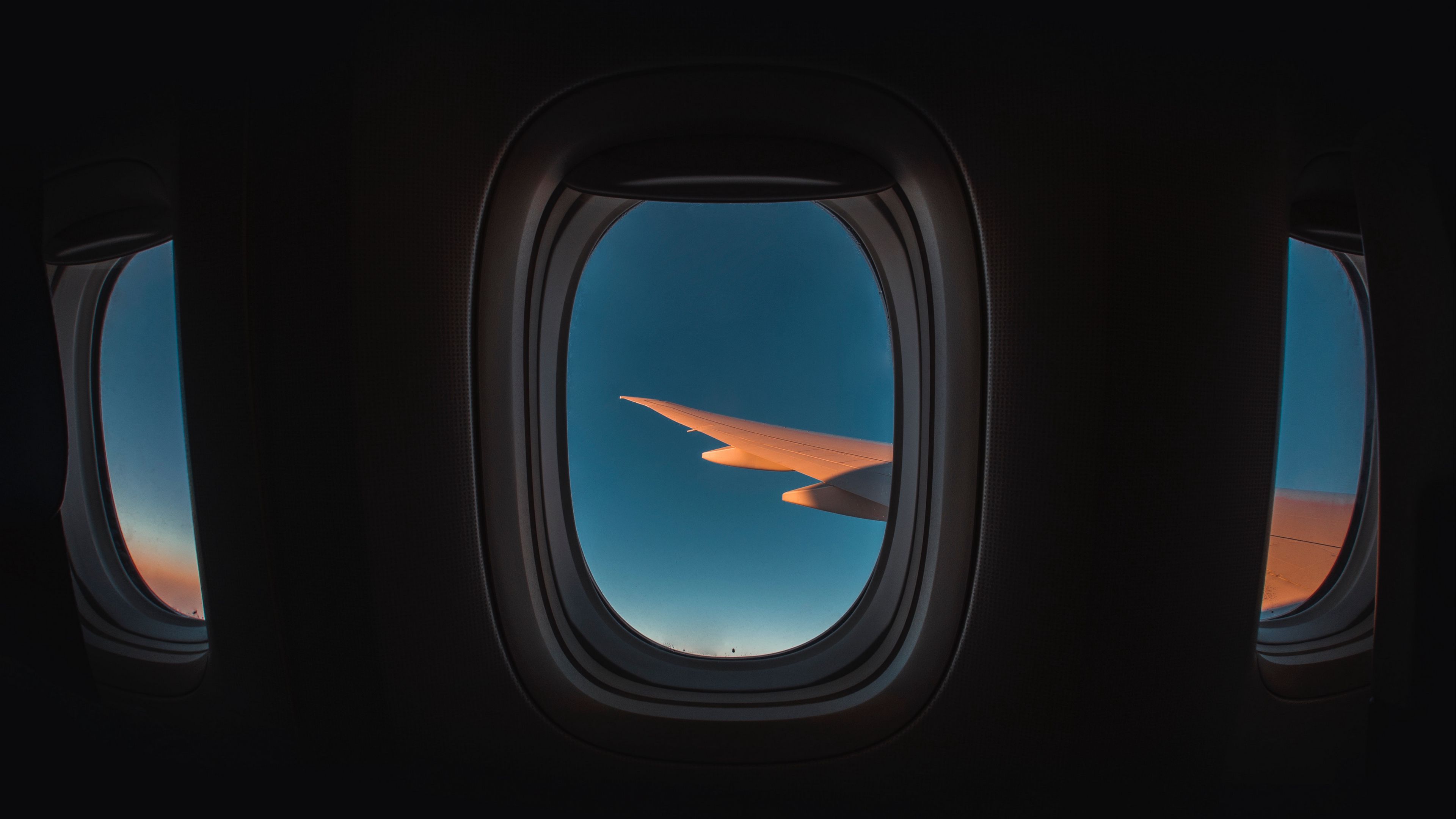 Download wallpaper 3840x2160 porthole, window, plane, wing, sky, flight 4k uhd 16:9 HD background