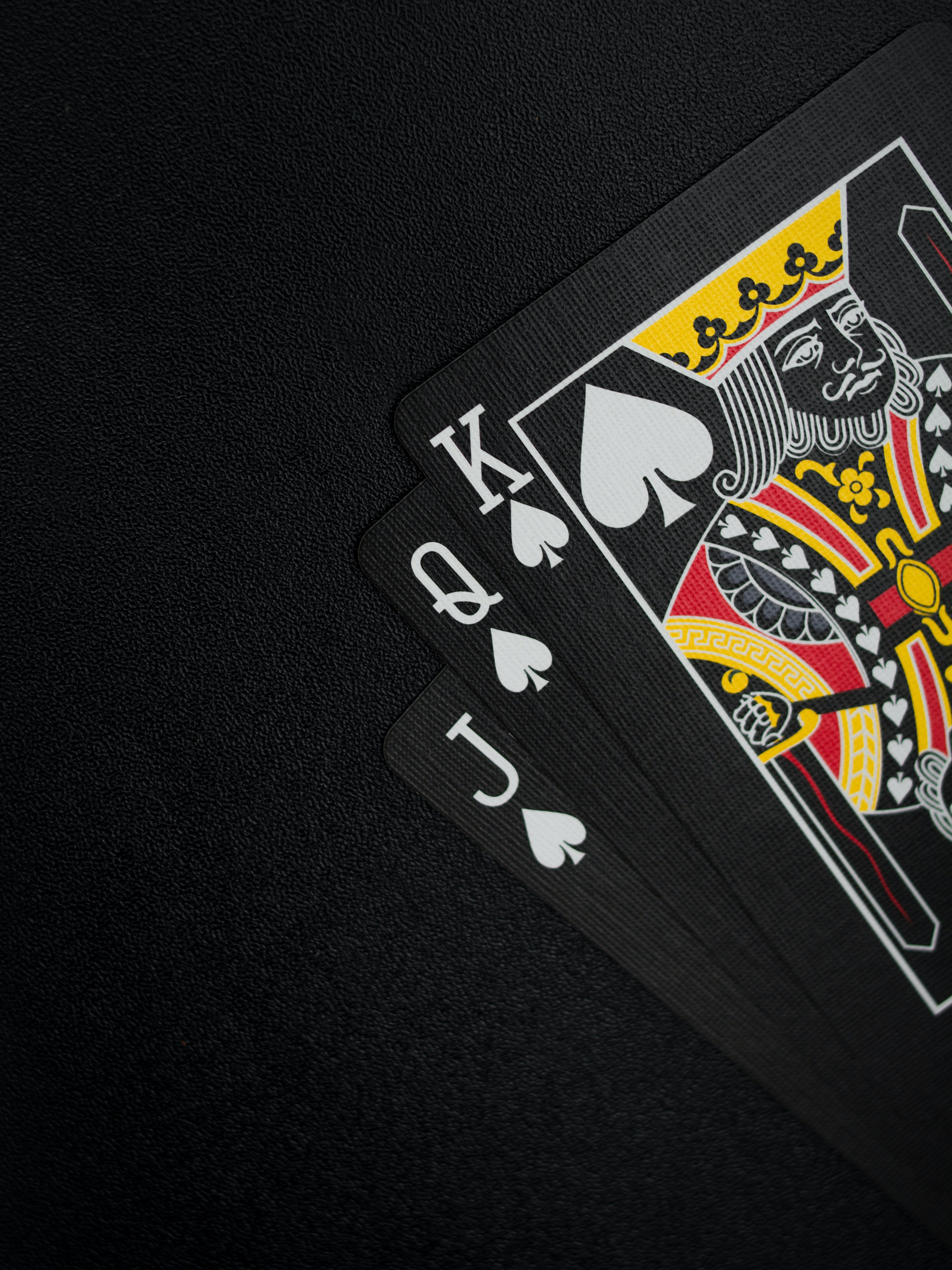 Black Playing Cards on Black Background · Free