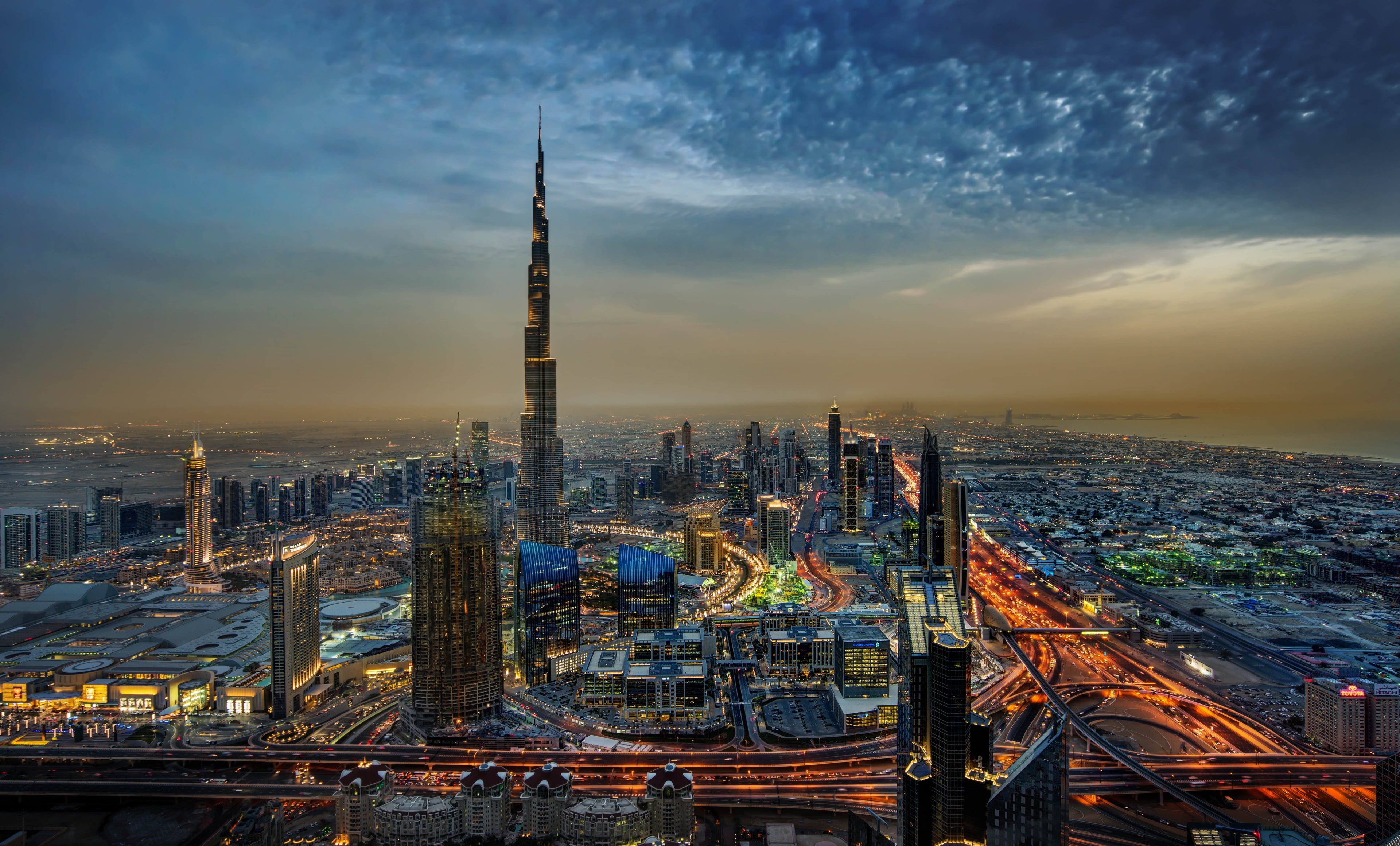Wallpaper / 4K, city, cloud, travel destinations, illuminated, dubai 4k wallpaper most downloaded, architecture, sunset, tower, tall, office building exterior free download