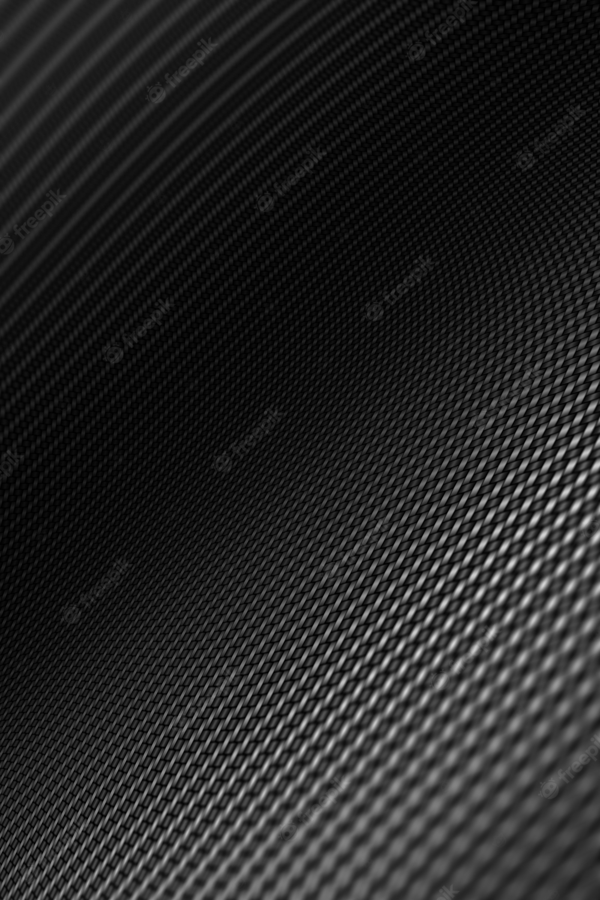 Premium Photo. Modern background with distorted black carbon fiber smooth on surface under angle