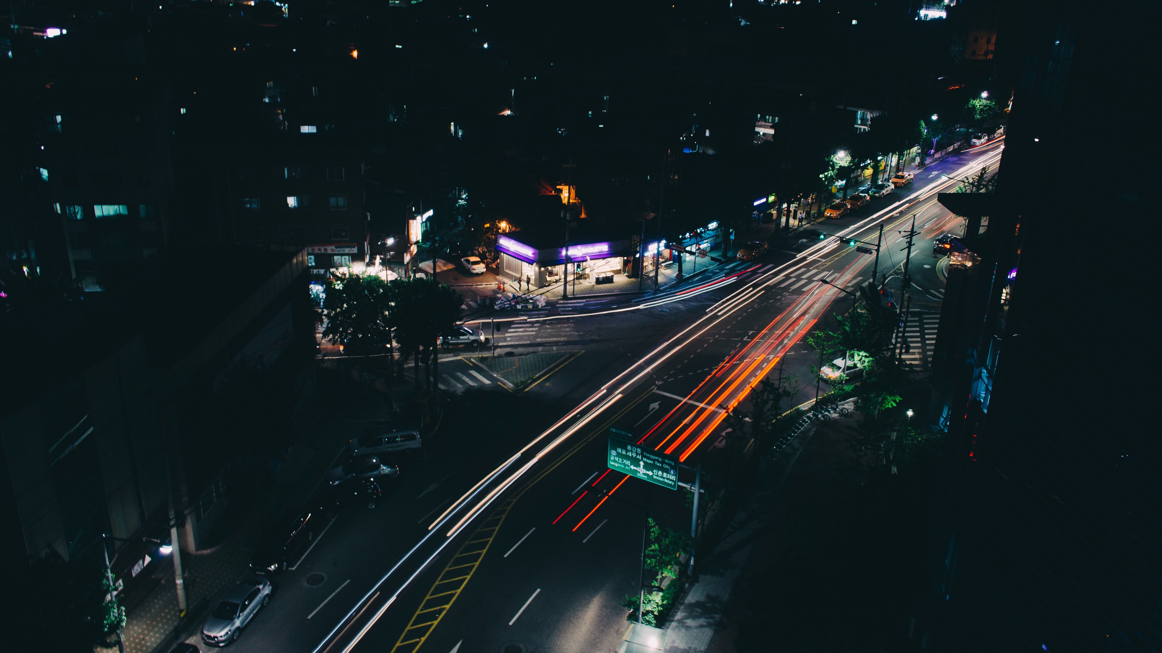 Wallpaper / a long exposure shot of a dark street in seoul with orange light trails, dark seoul neighborhood 4k wallpaper free download