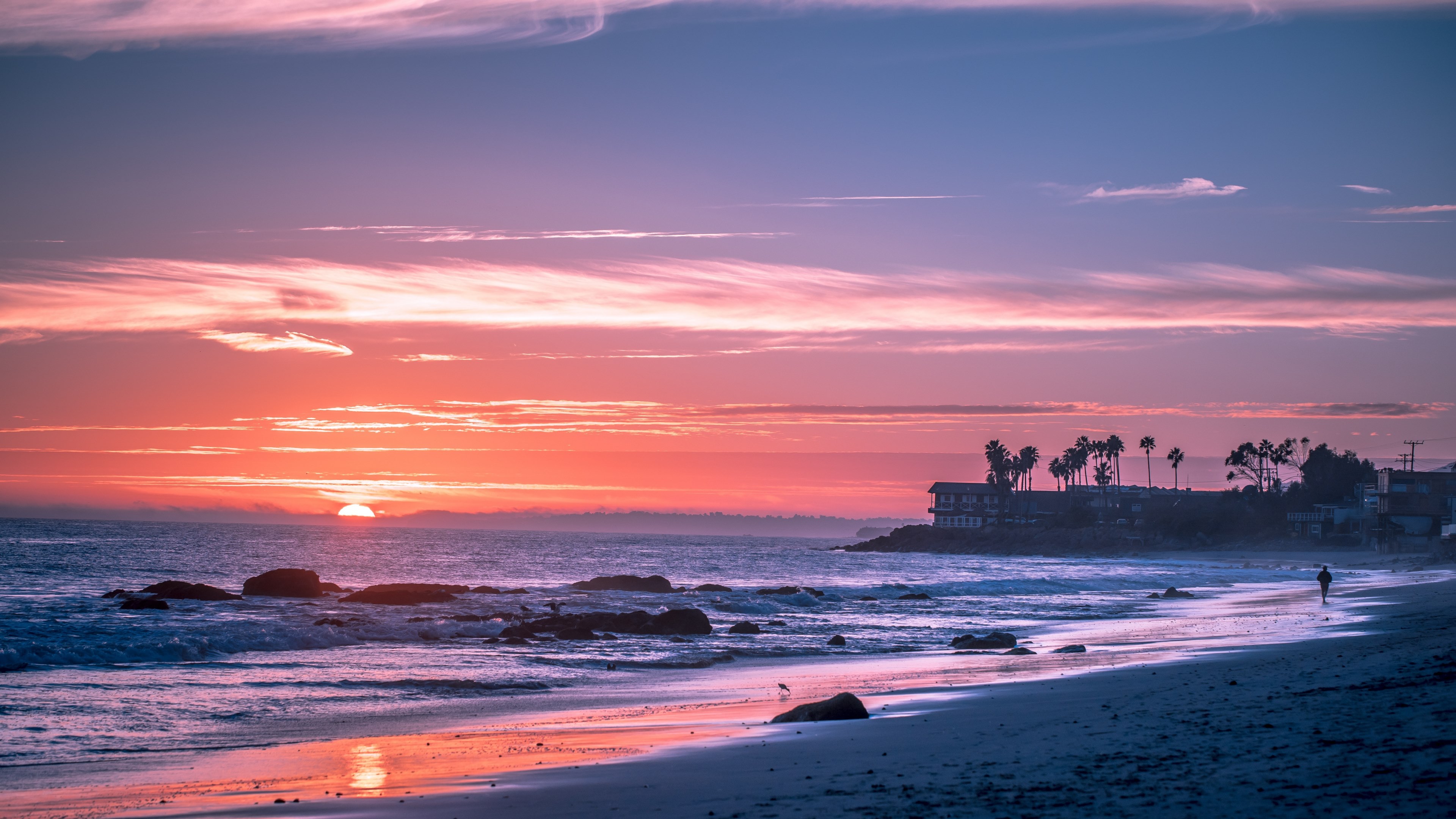 Wallpaper / a pink sky and the sun going down on the horizon and the sea at malibu beach, palm trees and water_ 4k wallpaper free download