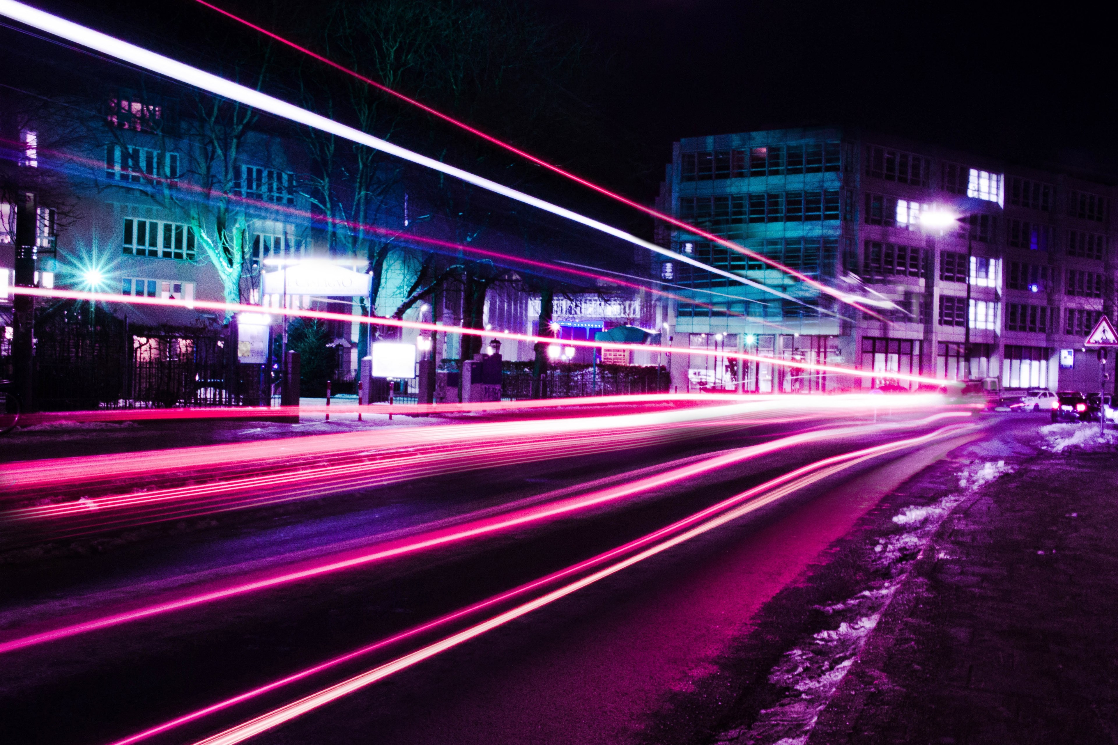 Wallpaper / a long exposure shot of pink and purple neon light trails in munich, neon light trails in munich 4k wallpaper free download