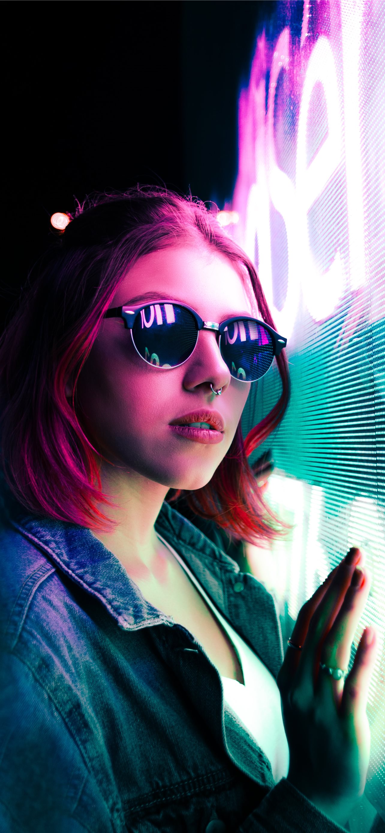 unknown celebrity standing beside blue and purple. iPhone Wallpaper Free Download