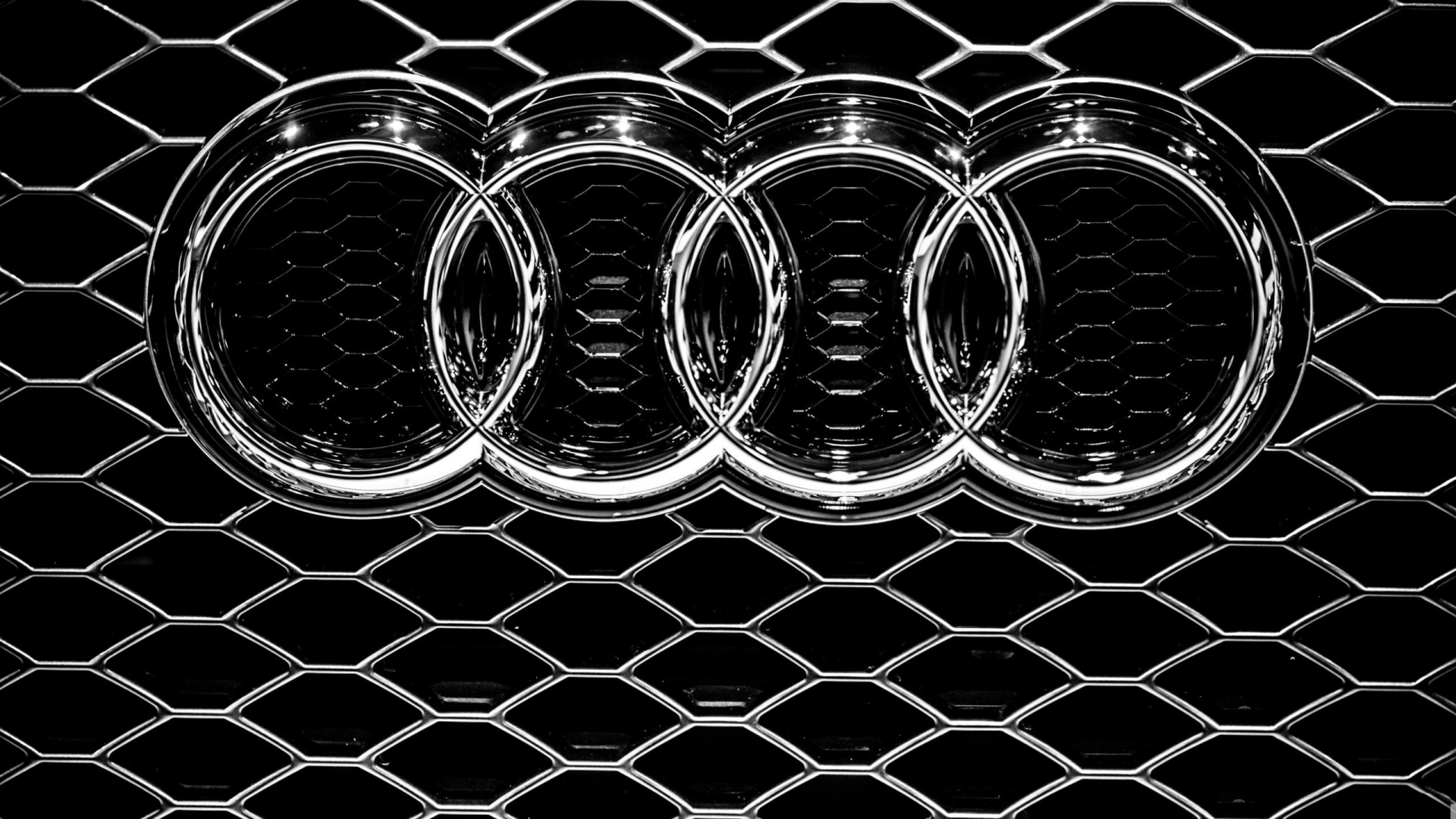 Audi emblem on a grille logo wallpaper