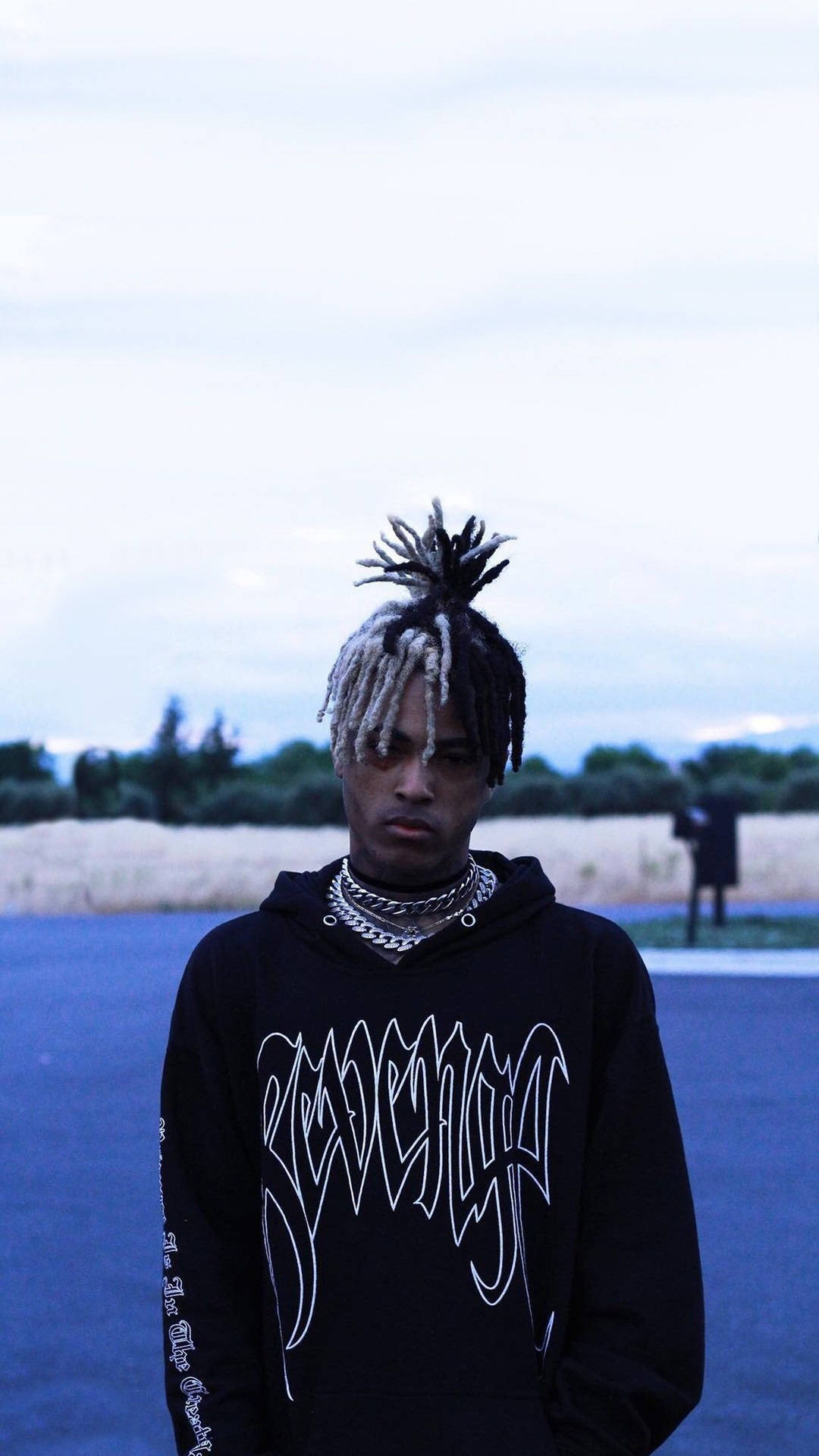 Download Fans of XXXTentacion Rock His Signature Black Hoodie Wallpaper