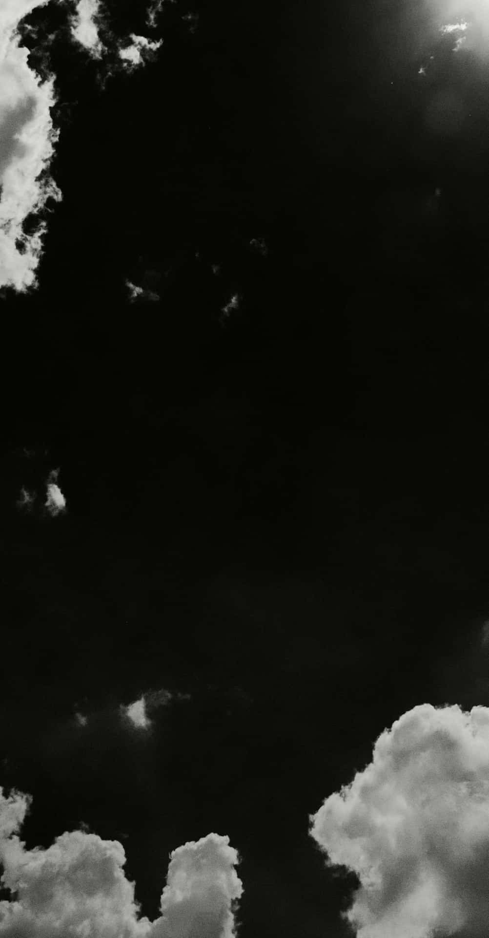 Download The Artful Beauty of Black and White Clouds Wallpaper