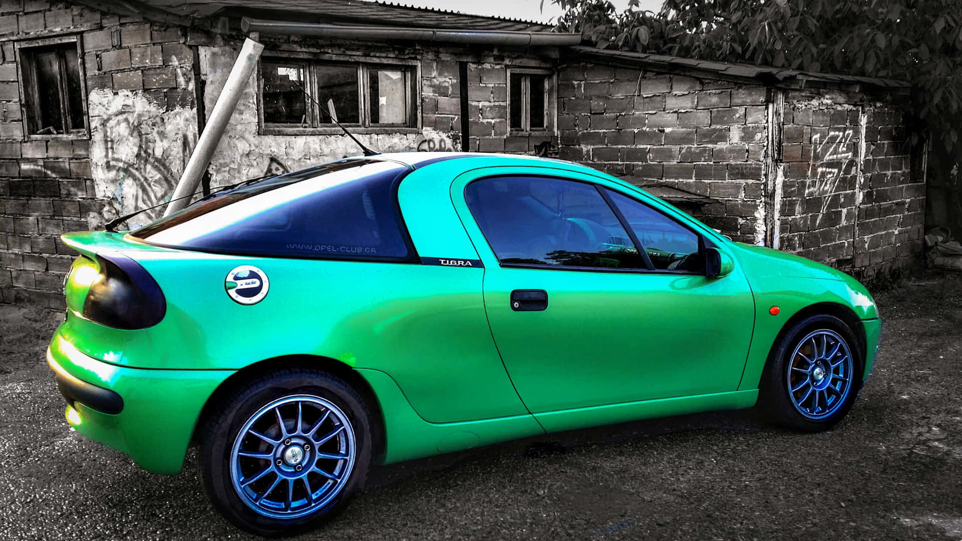 Download Pristine Opel Tigra Coupe On A Serene Road Wallpaper