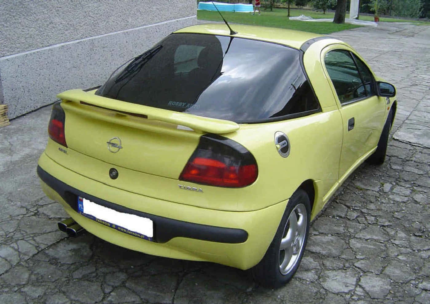 Download Pristine Opel Tigra Showcased Amidst Scenic Background Wallpaper