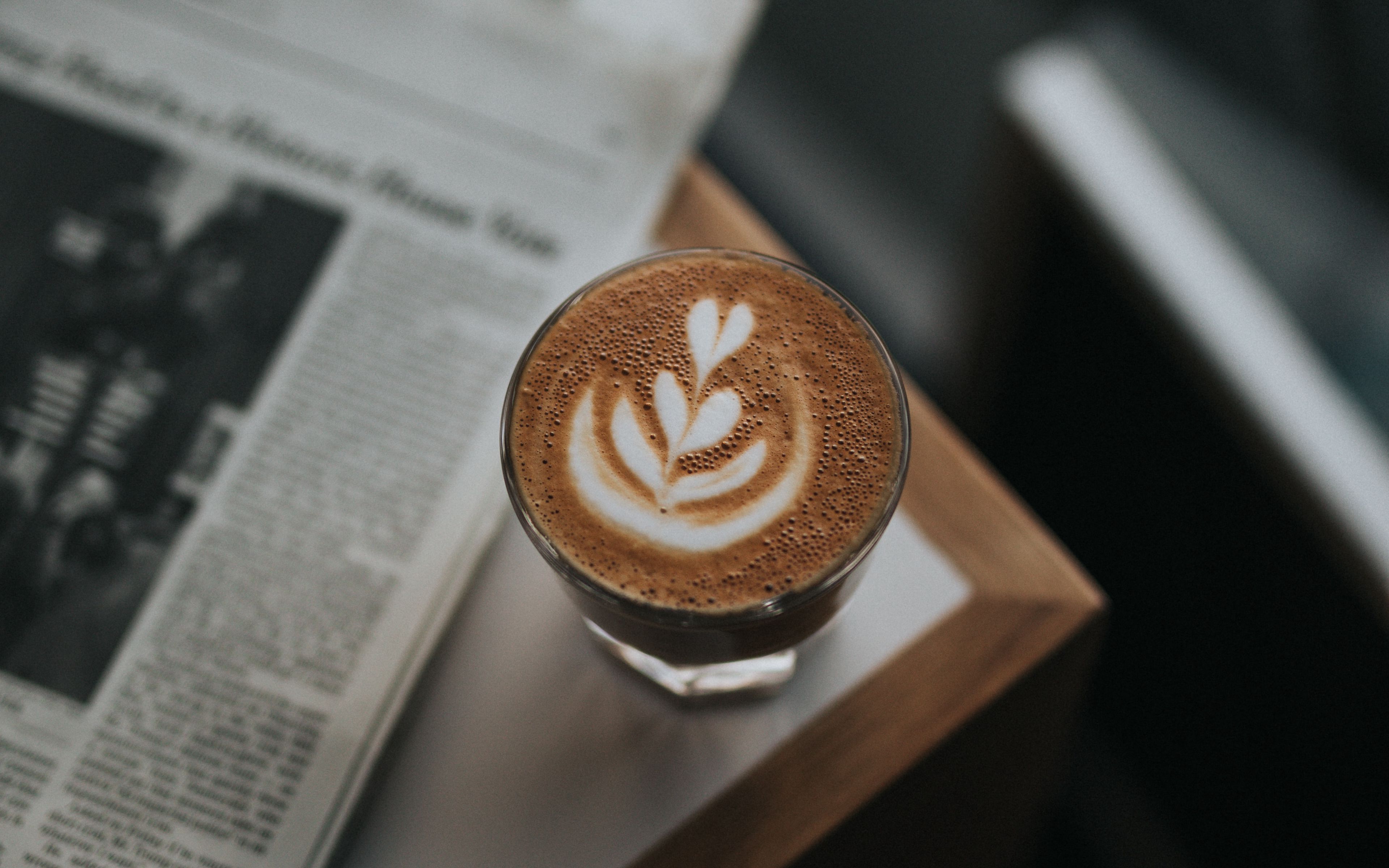 Coffee beside newspaper Wallpaper 4k Ultra HD