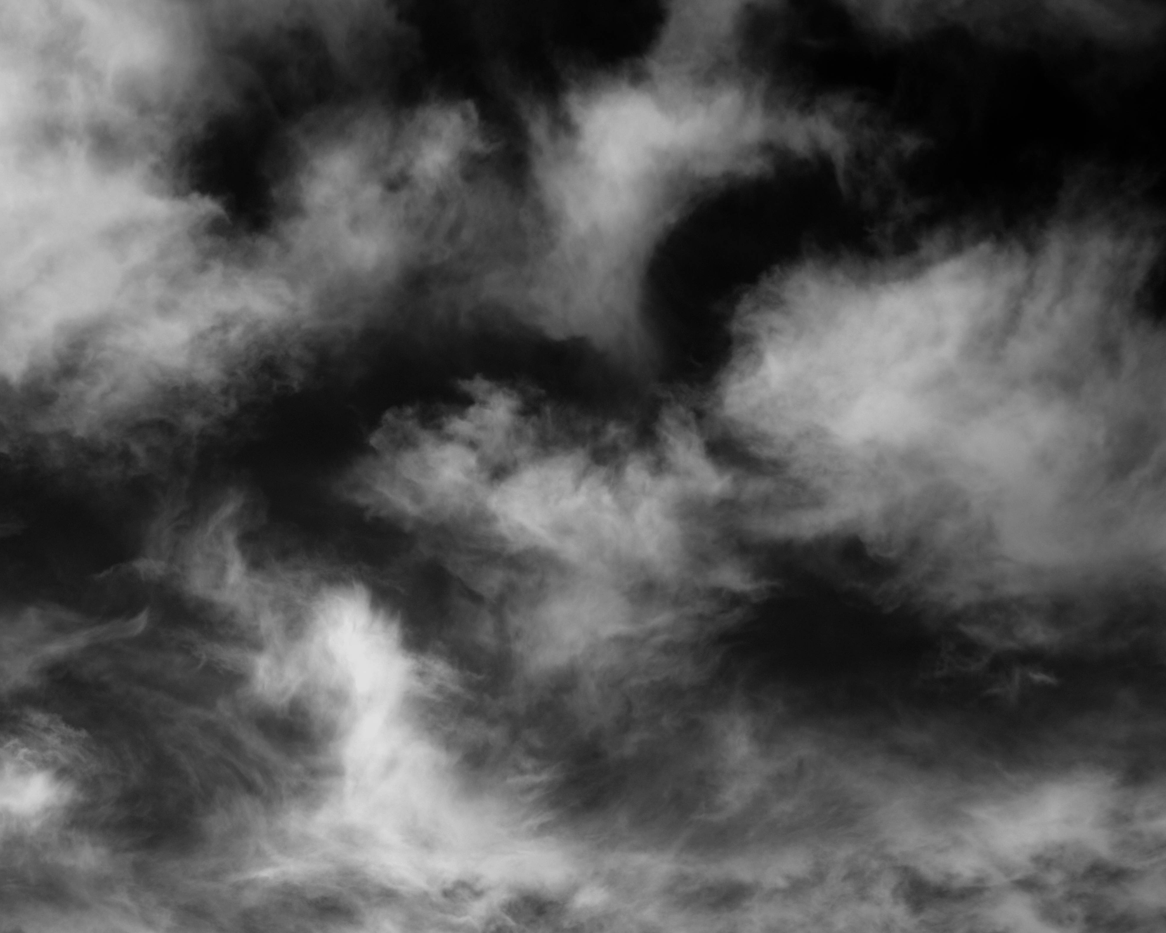 Download Dramatic White Clouds against a Black Sky Wallpaper
