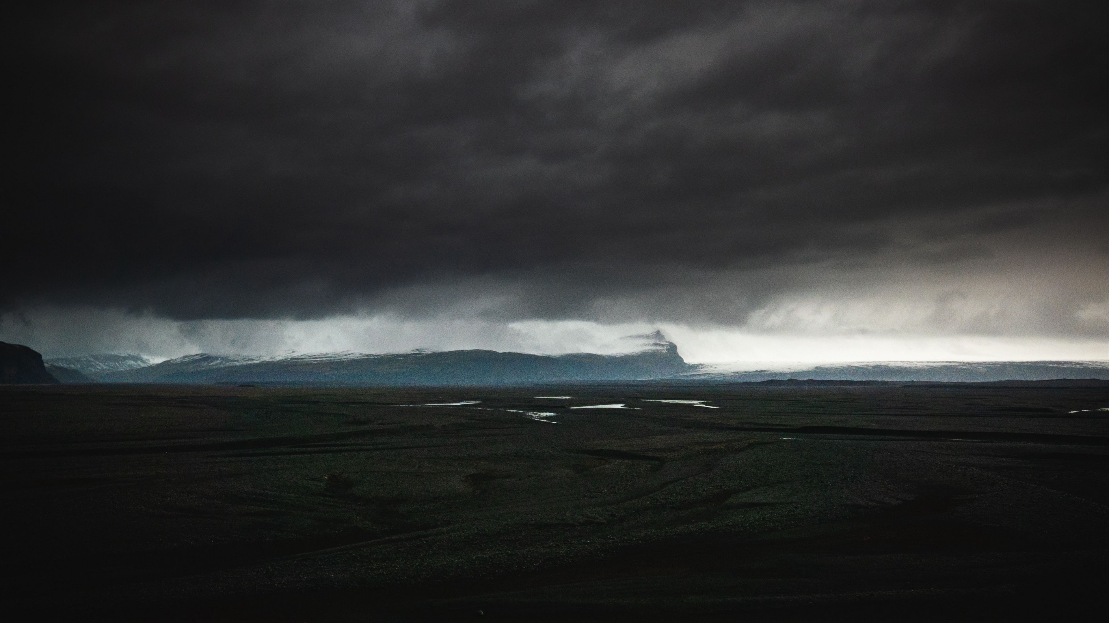 Download wallpaper 3840x2160 island, dark, clouds, iceland 4k uhd 16:9 HD background