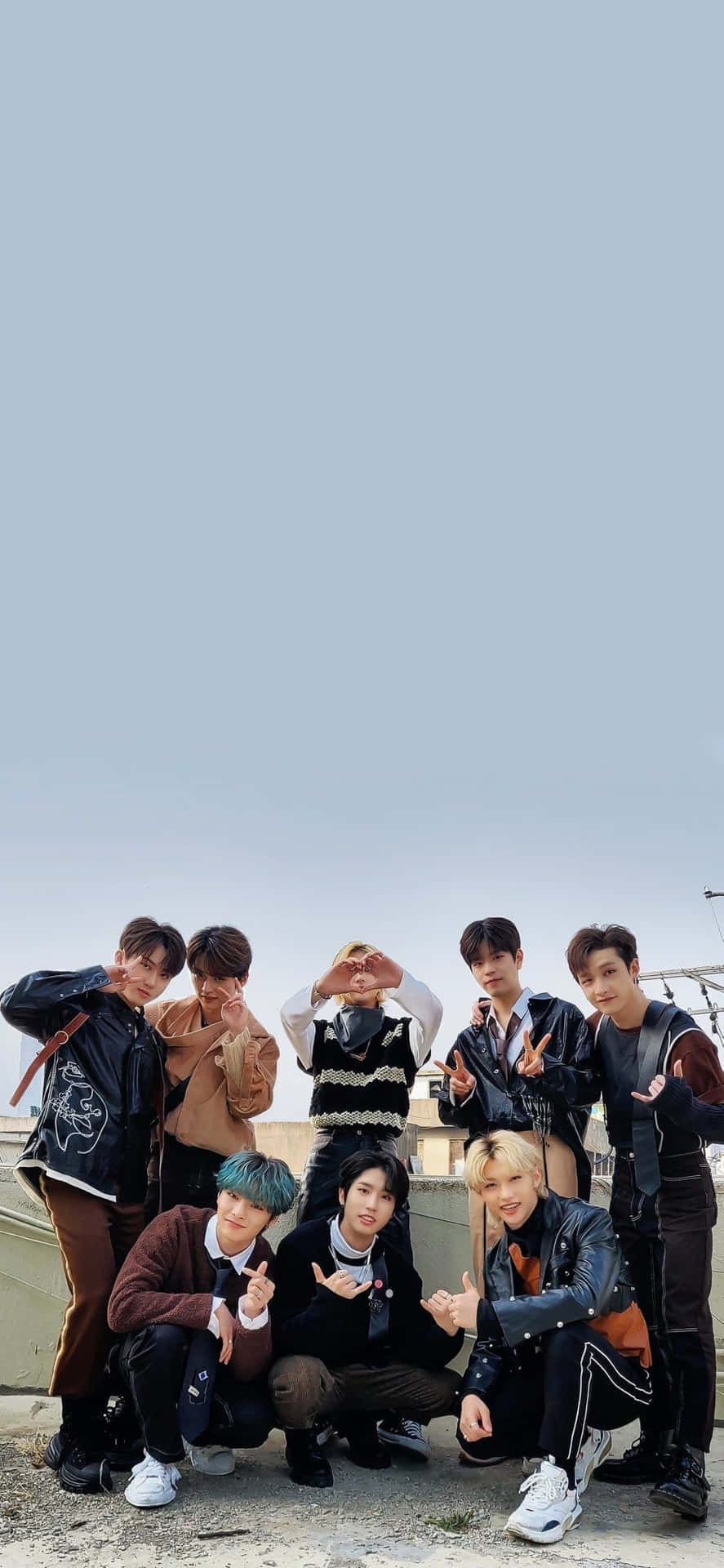 Download Members Of South Korean Pop Group Stray Kids Strike A Pose In Tech Inspired Outfits For Their 2020 Promotional Photo Shoot. Wallpaper
