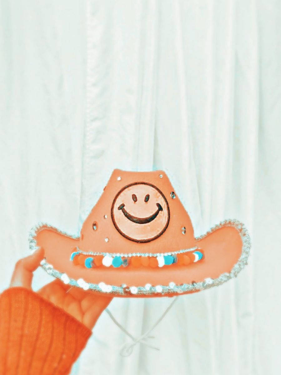Download Orange Hued Cowboy Hat Preppy Pfp Wallpapers