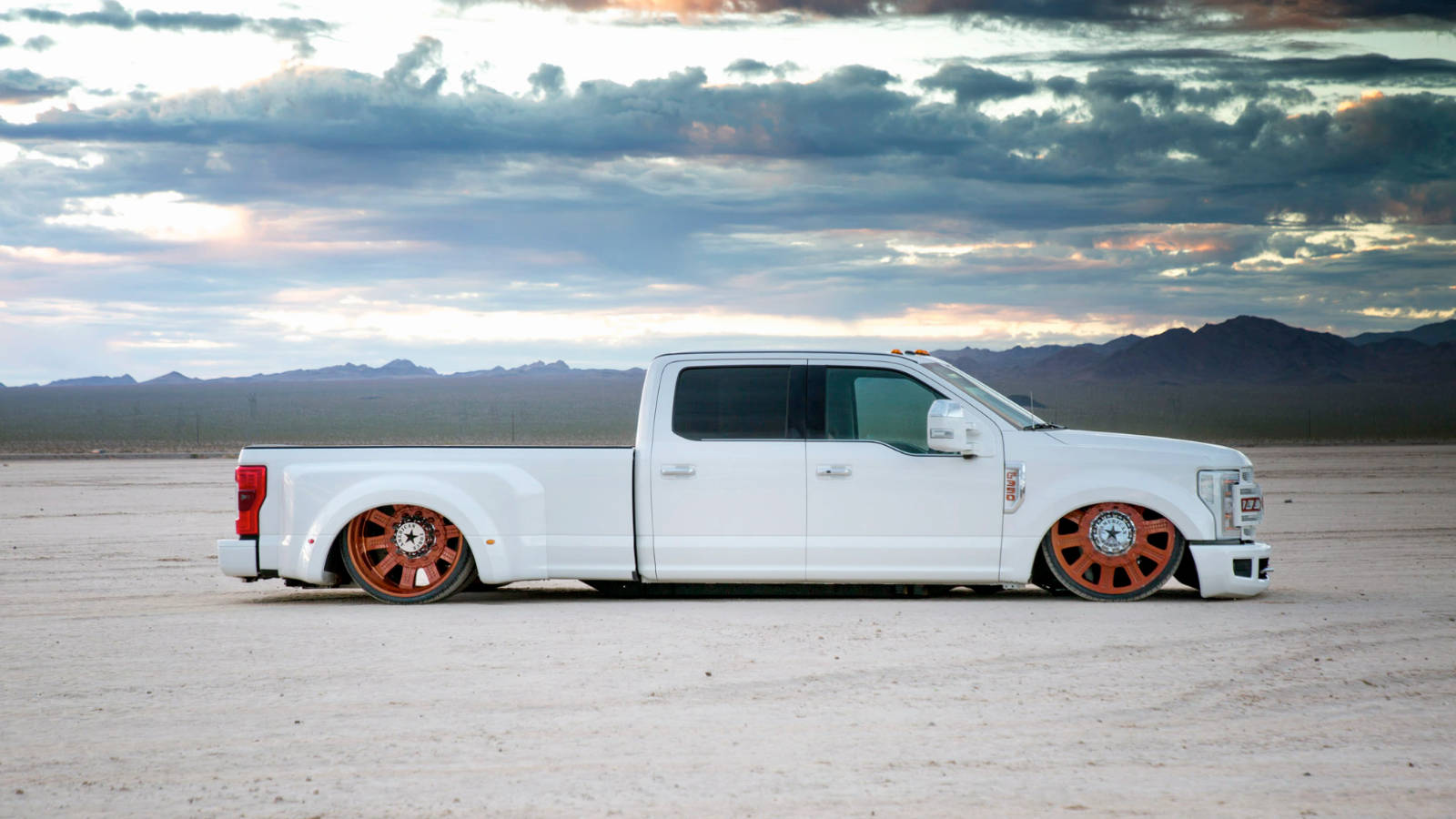 Download Side Shot of Classy White Dropped Truck Wallpaper