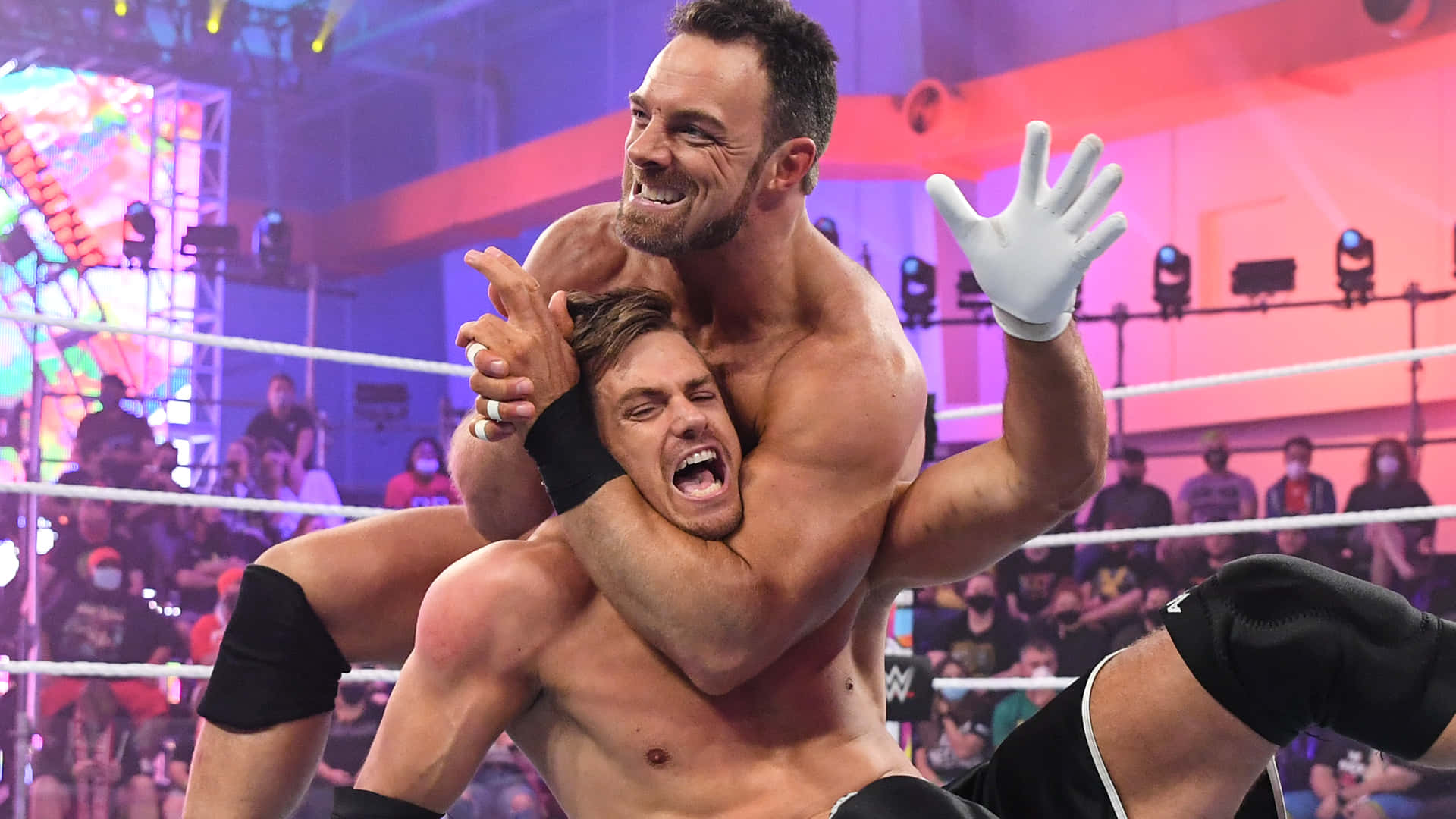 Download LA Knight taking on Grayson Waller at Halloween Havoc event Wallpaper