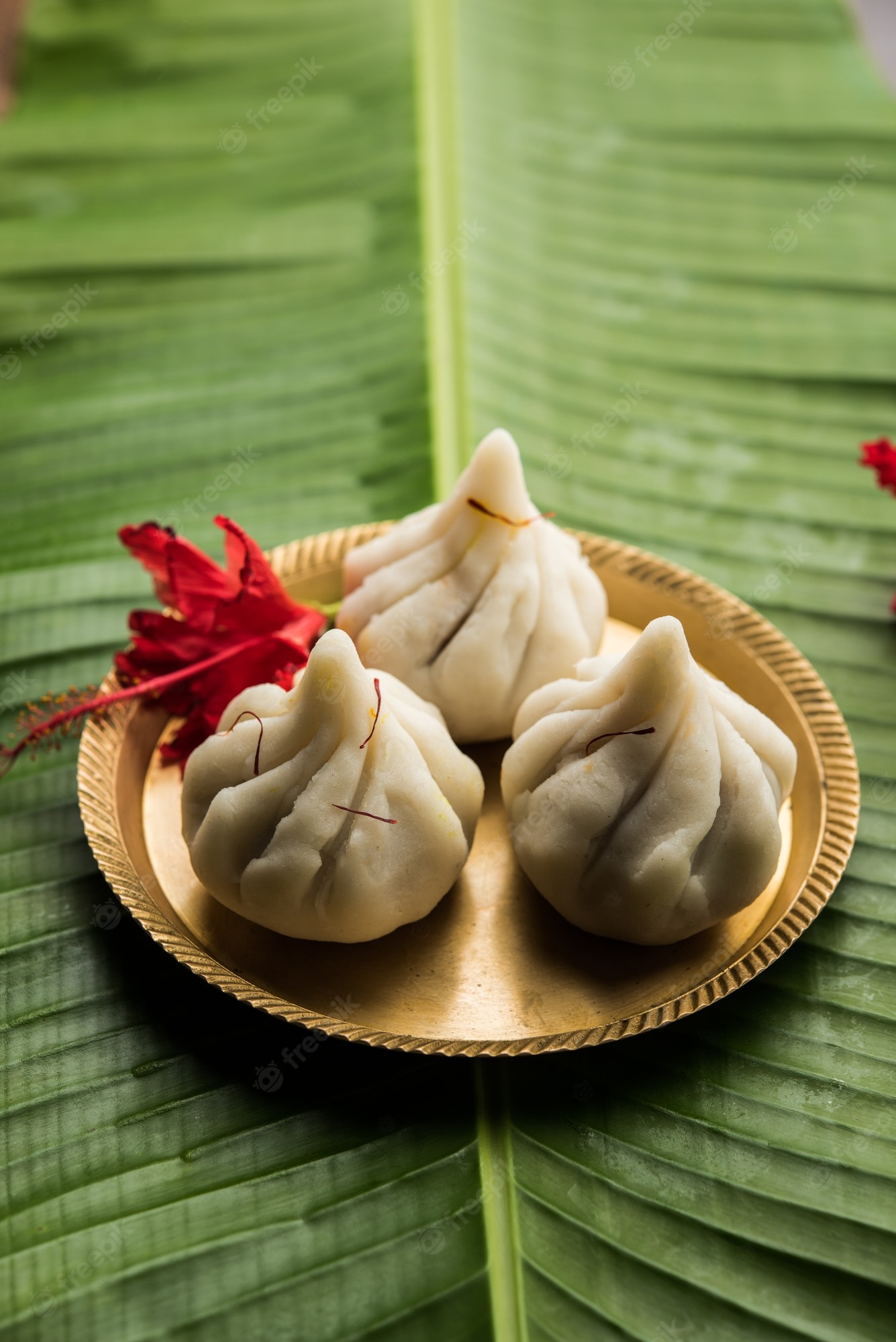 Premium Photo. Ukdiche Modak Are Steamed Dumplings With An Outer Rice Flour Dough And A Coconut Jaggery Stuffing, Indian Food Offered To Lord Ganesha On Chaturthi
