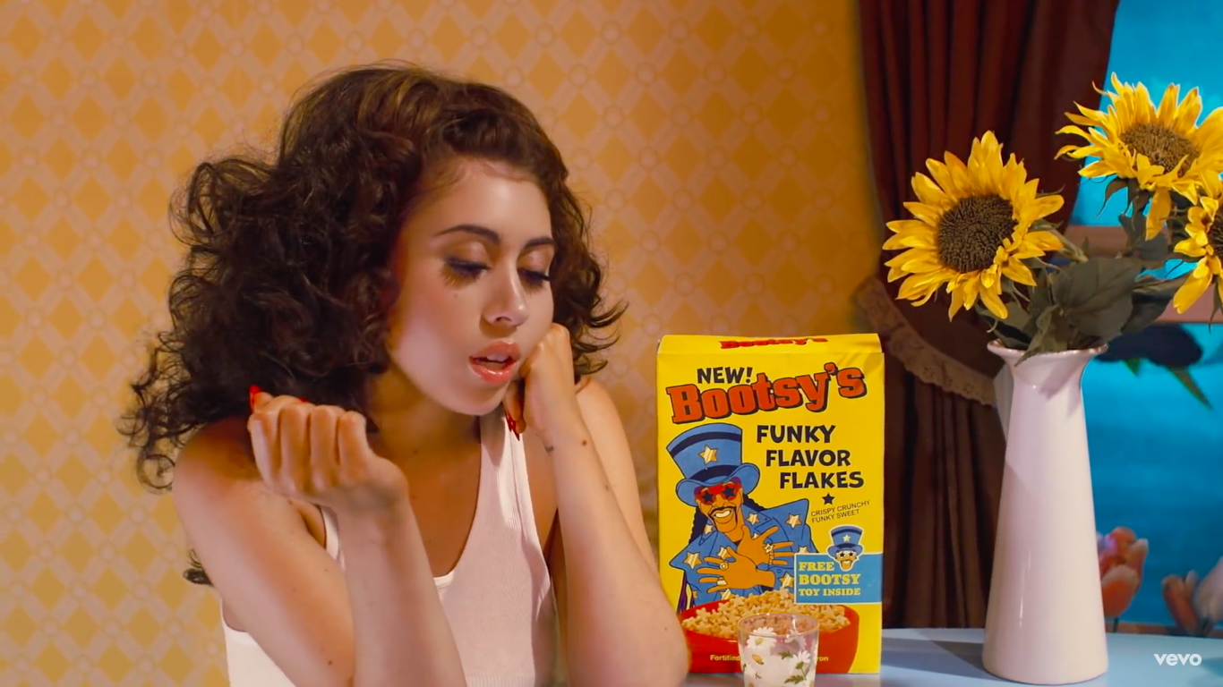 Kali Uchis Grows her own Flower Boy for After the Storm Music Video