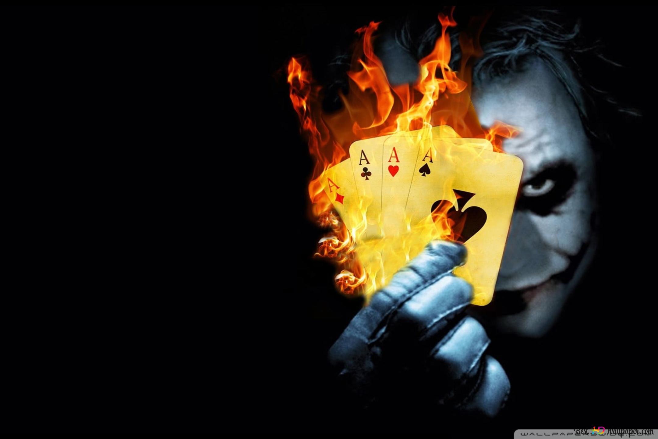 Joker hand burning cards 4K wallpaper download