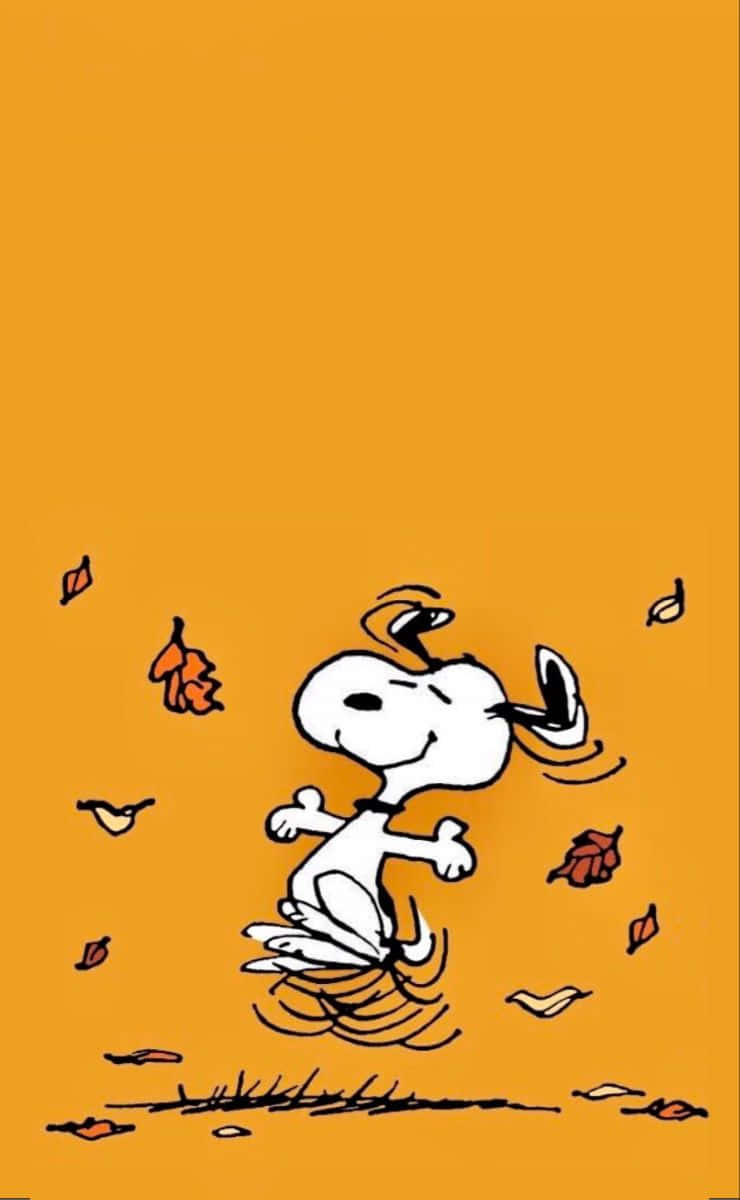 Download Snoopy celebrates autumn in all its glory Wallpaper