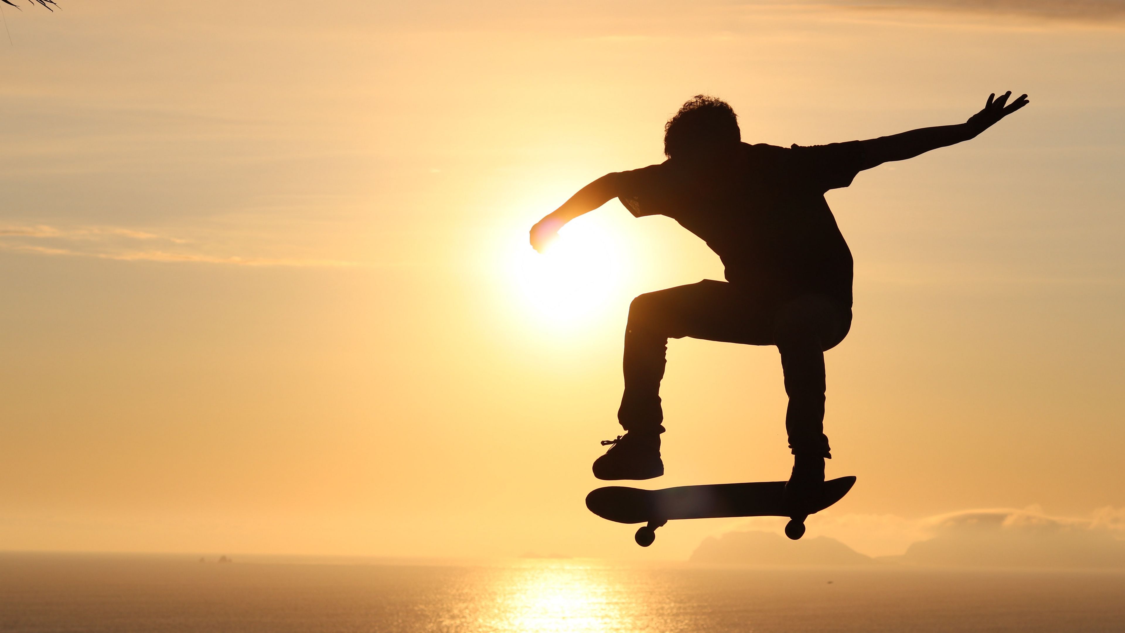 Download wallpaper 3840x2160 skateboard, skate, skater, trick, silhouette, sunset 4k uhd 16:9 HD background