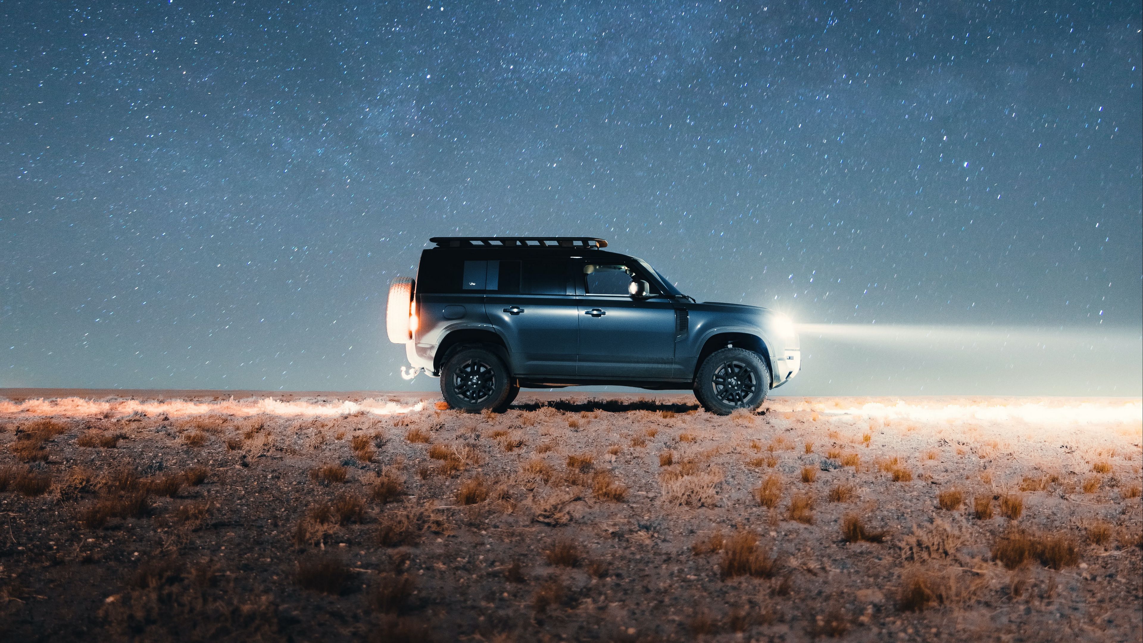 Download wallpaper 3840x2160 land rover defender, land rover, car, suv, gray, night 4k uhd 16:9 HD background