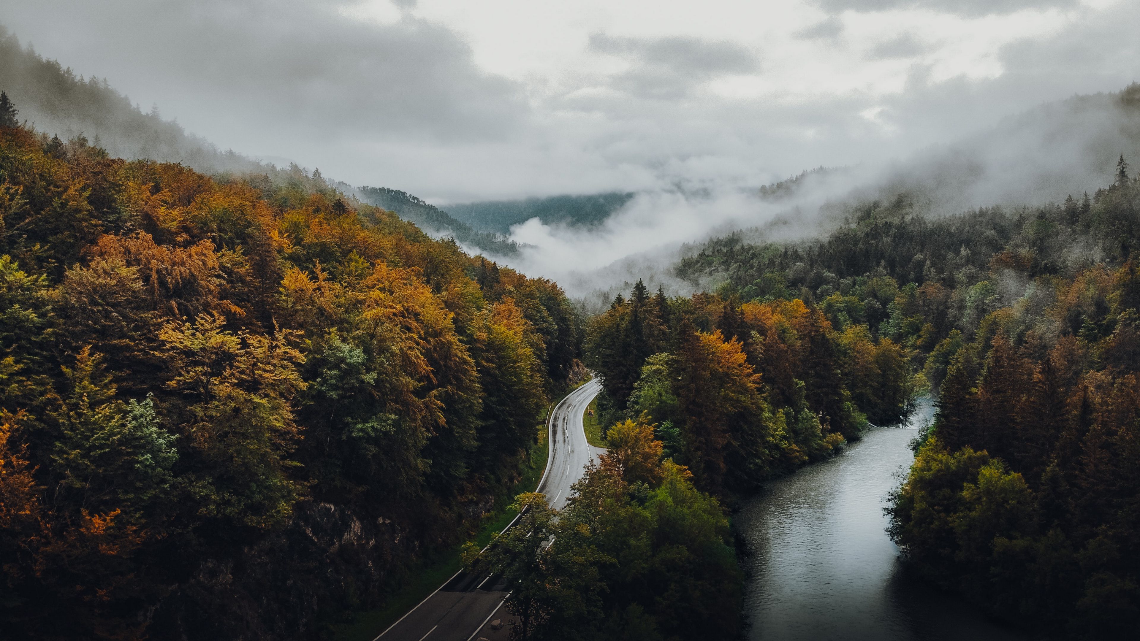 Download wallpaper 3840x2160 road, forest, autumn, fog, clouds 4k uhd 16:9 HD background