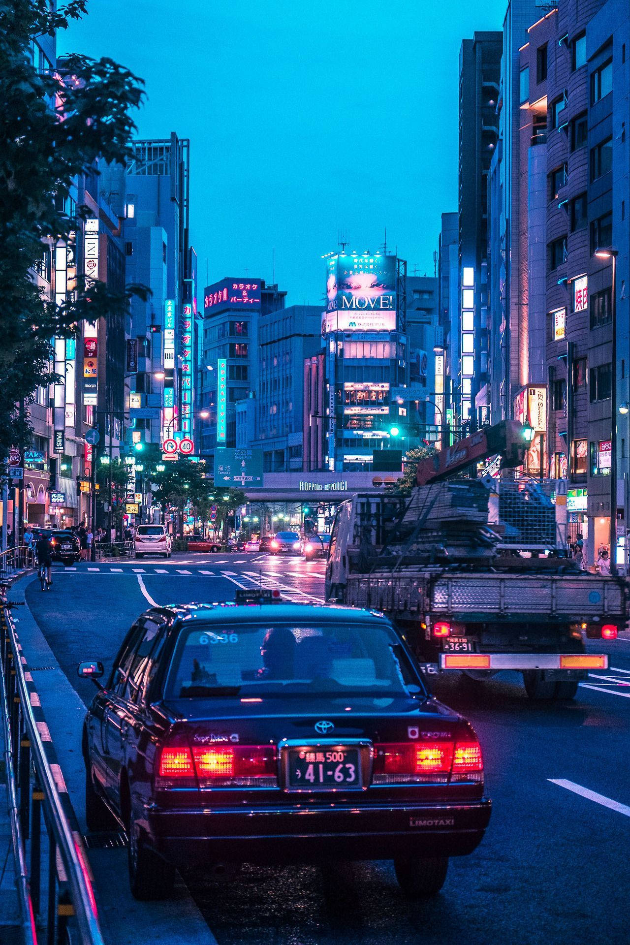 Download Nightlife Aesthetics: JDM Car illuminating the Tokyo Streets Wallpaper