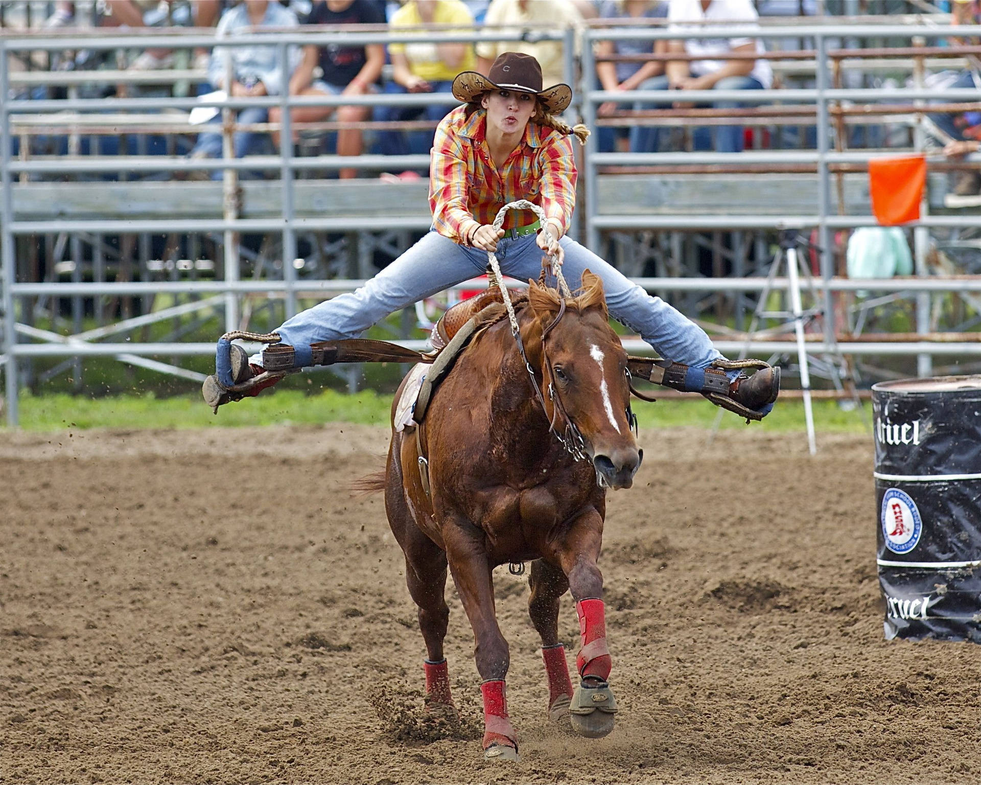 Download An electrifying moment of barrel racing in action Wallpaper
