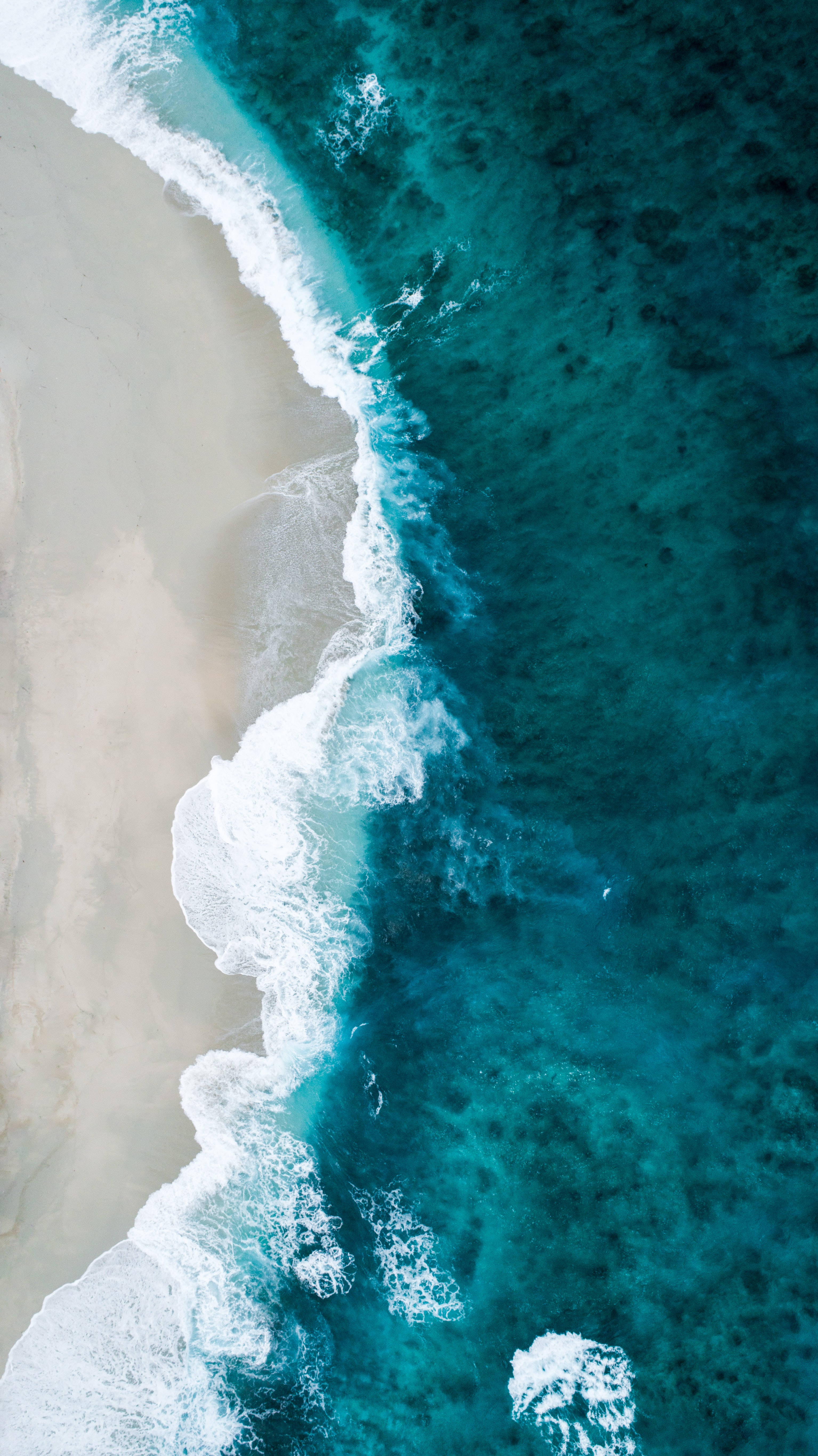 Download 4K Ultra HD Phone Blue Wavy Beach Wallpaper