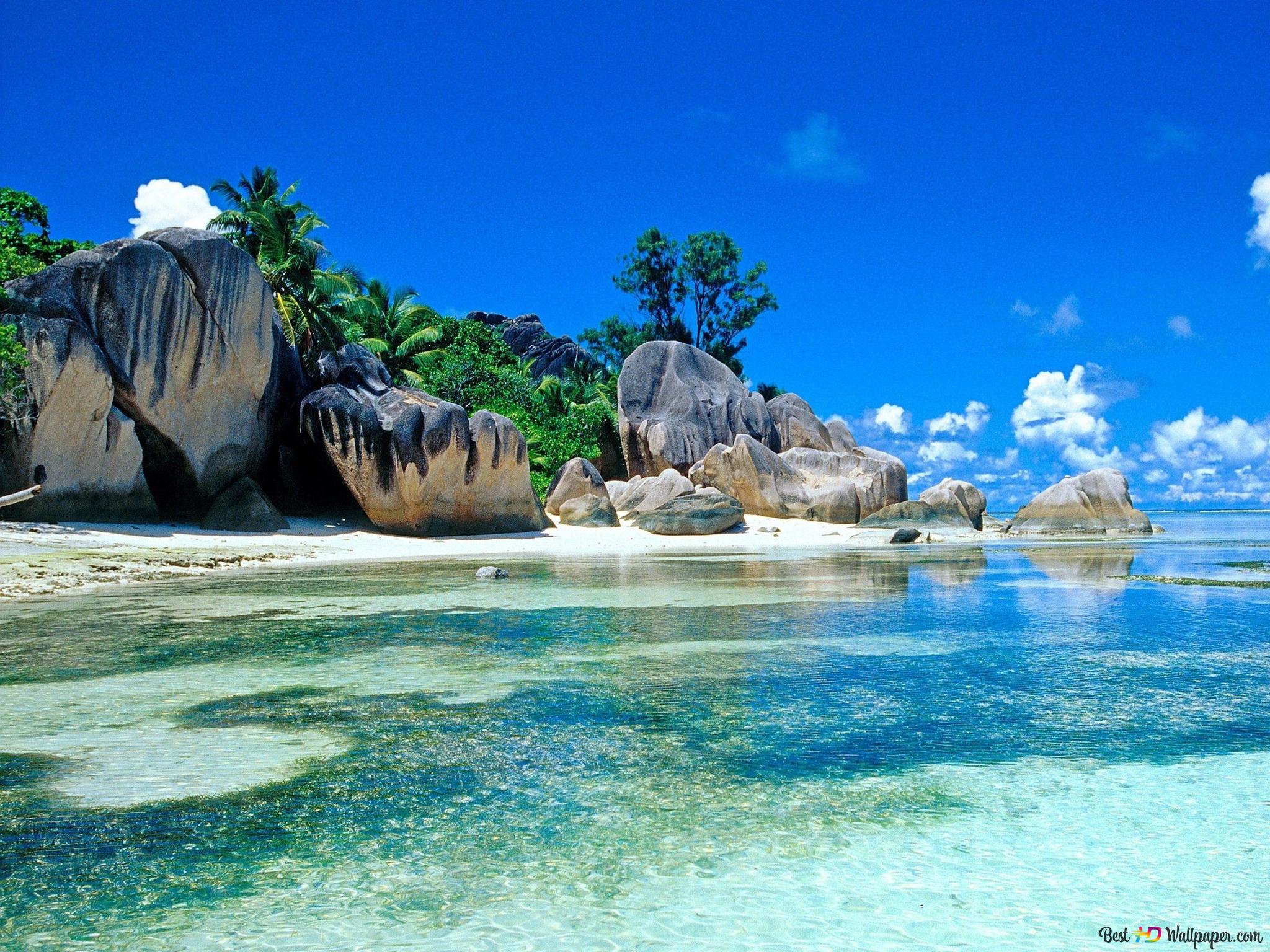 A tropical island by the sea in the most beautiful cloudy sky weather of summer 2K wallpaper download