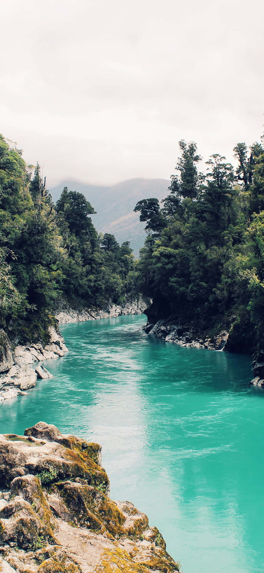Download Tranquil Lake Reflection amidst the Mountains