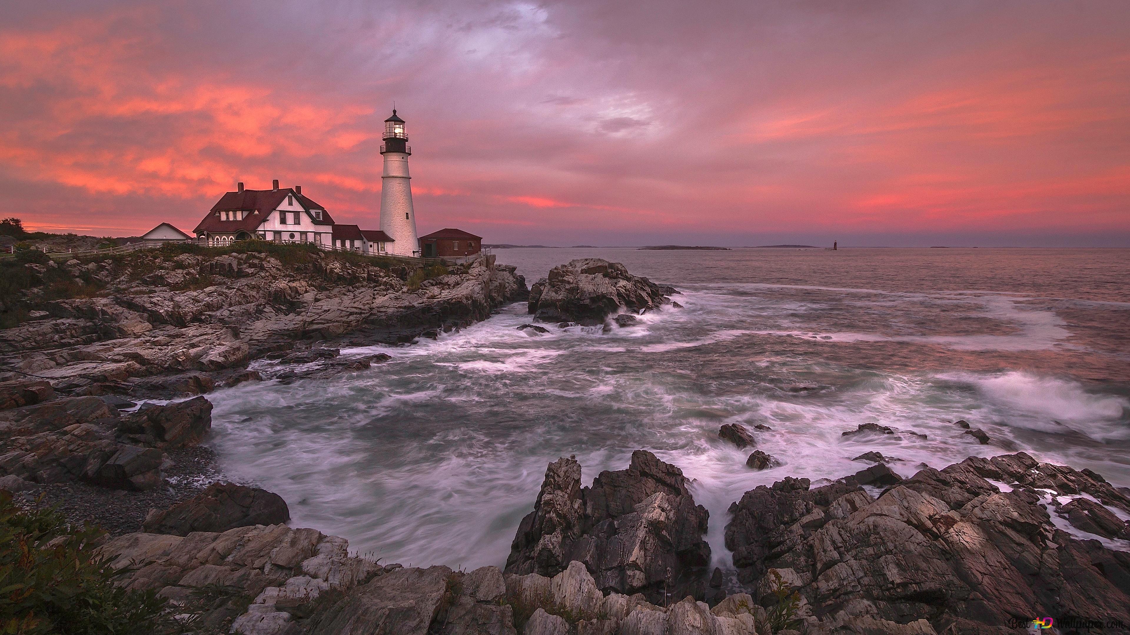 Lighthouse by the coast 4K wallpaper download