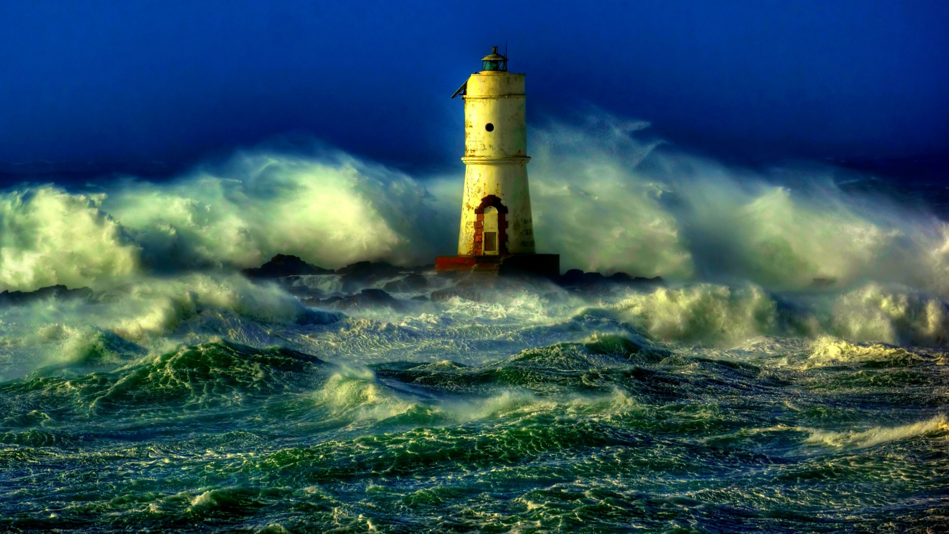 Lighthouse light during sea storm HD Wallpaper 4K Ultra HD