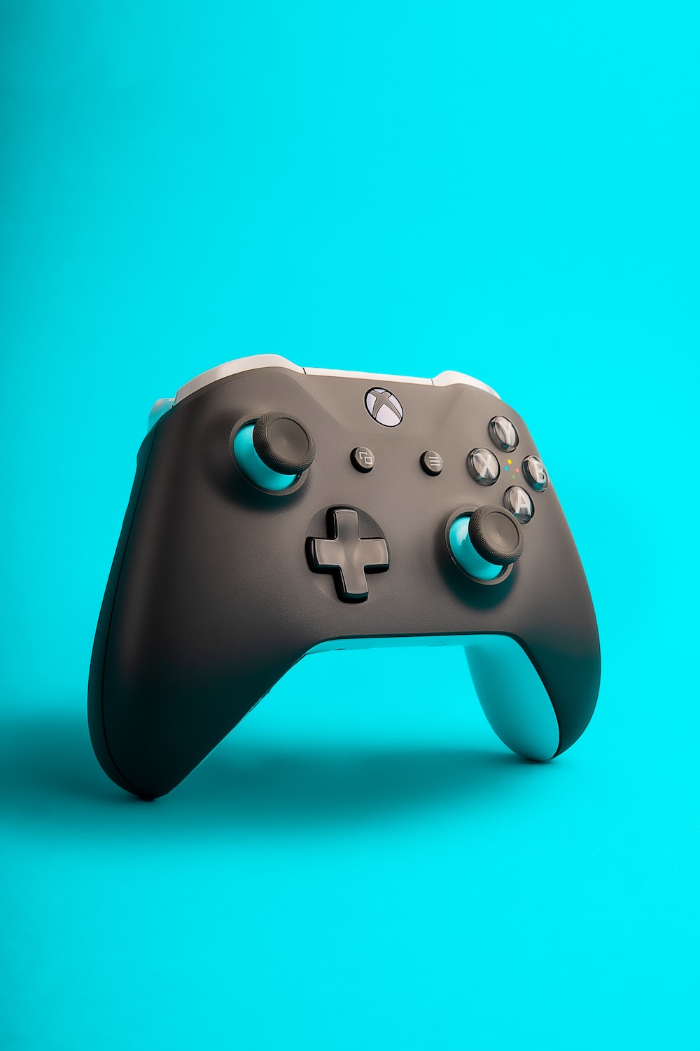 A close up of a controller on a blue background photo
