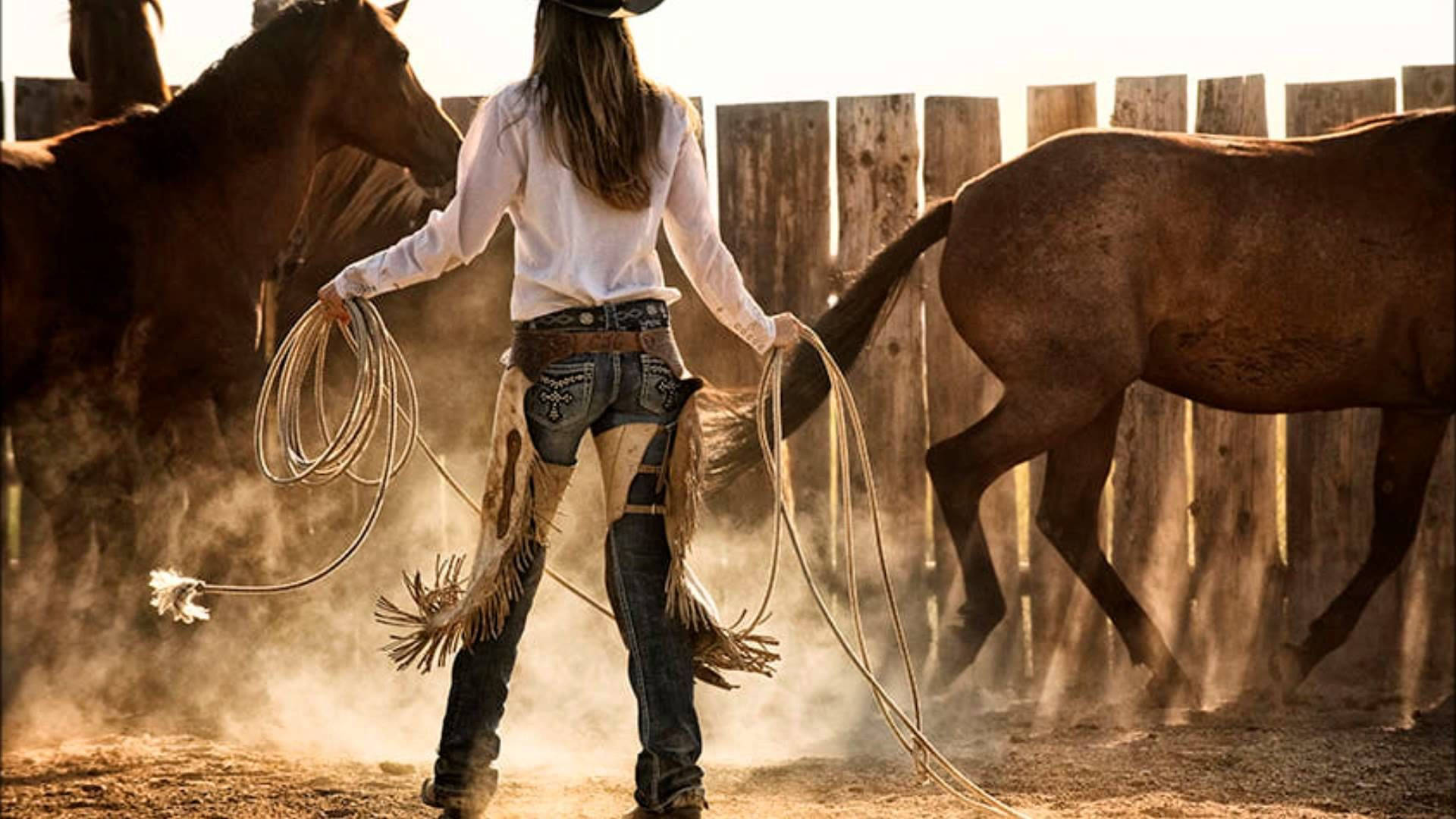 Download Cowgirl Holding A Rope Wallpaper