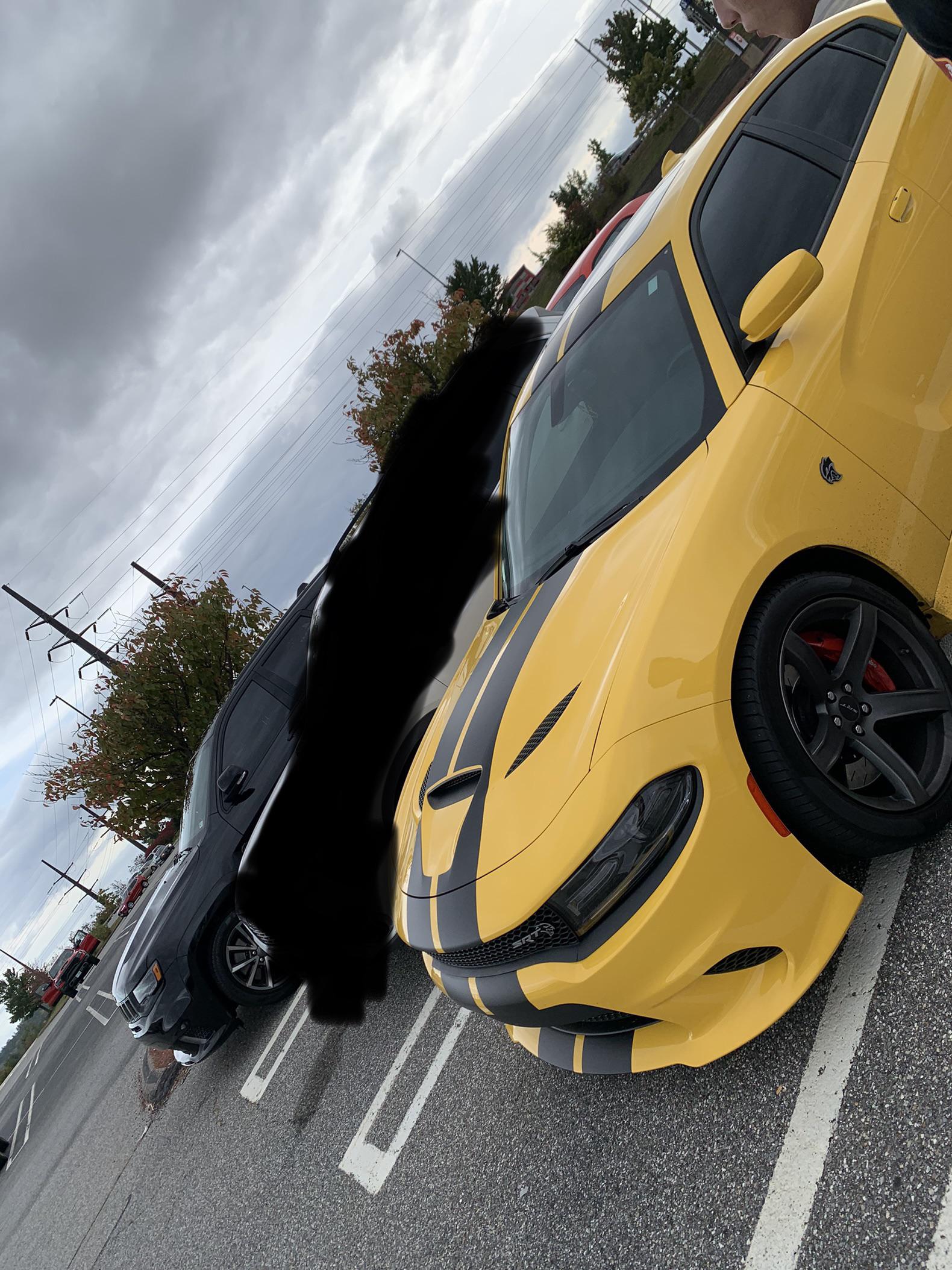 I come out to see my hellcat a random trackhawk and a TRX watching us in the back