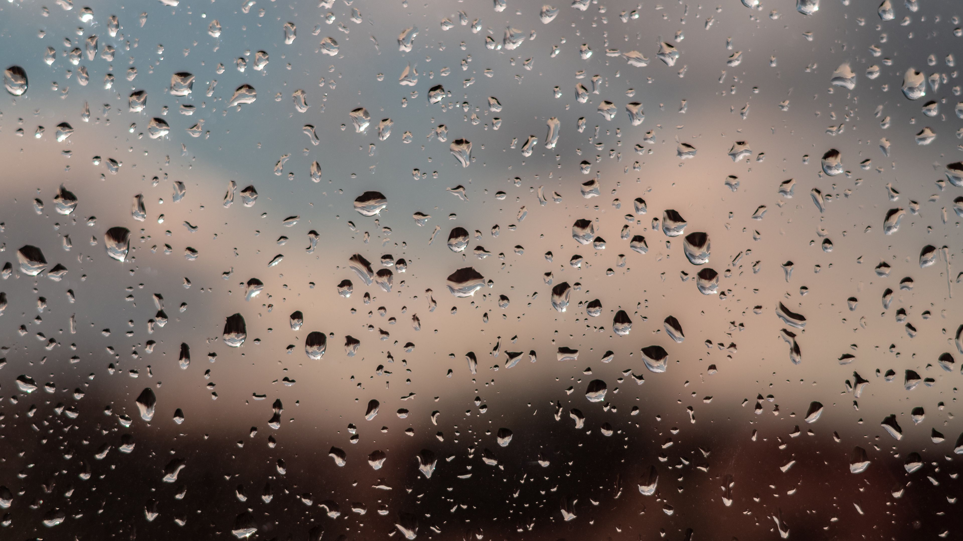 Download wallpaper 3840x2160 drops, glass, rain, window, moisture, blur 4k uhd 16:9 HD background