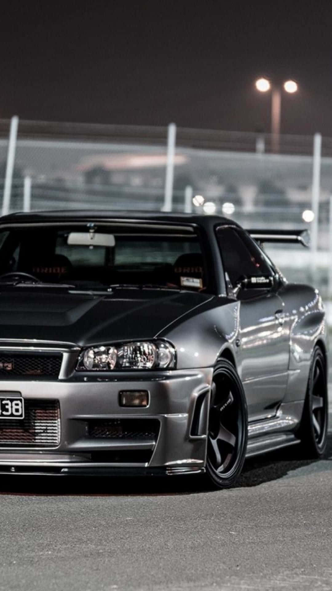 Download Turn heads in the sleek and powerful Nissan Skyline. Wallpaper