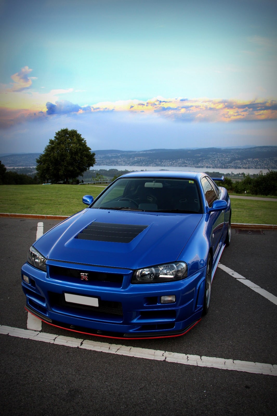 Hi There! This Is My Late 2000 Nissan Skyline R34 GT R Which I Recently Put On My New Bonnet. I Own This Car For Now 5 Years And Driving It In Switzerland