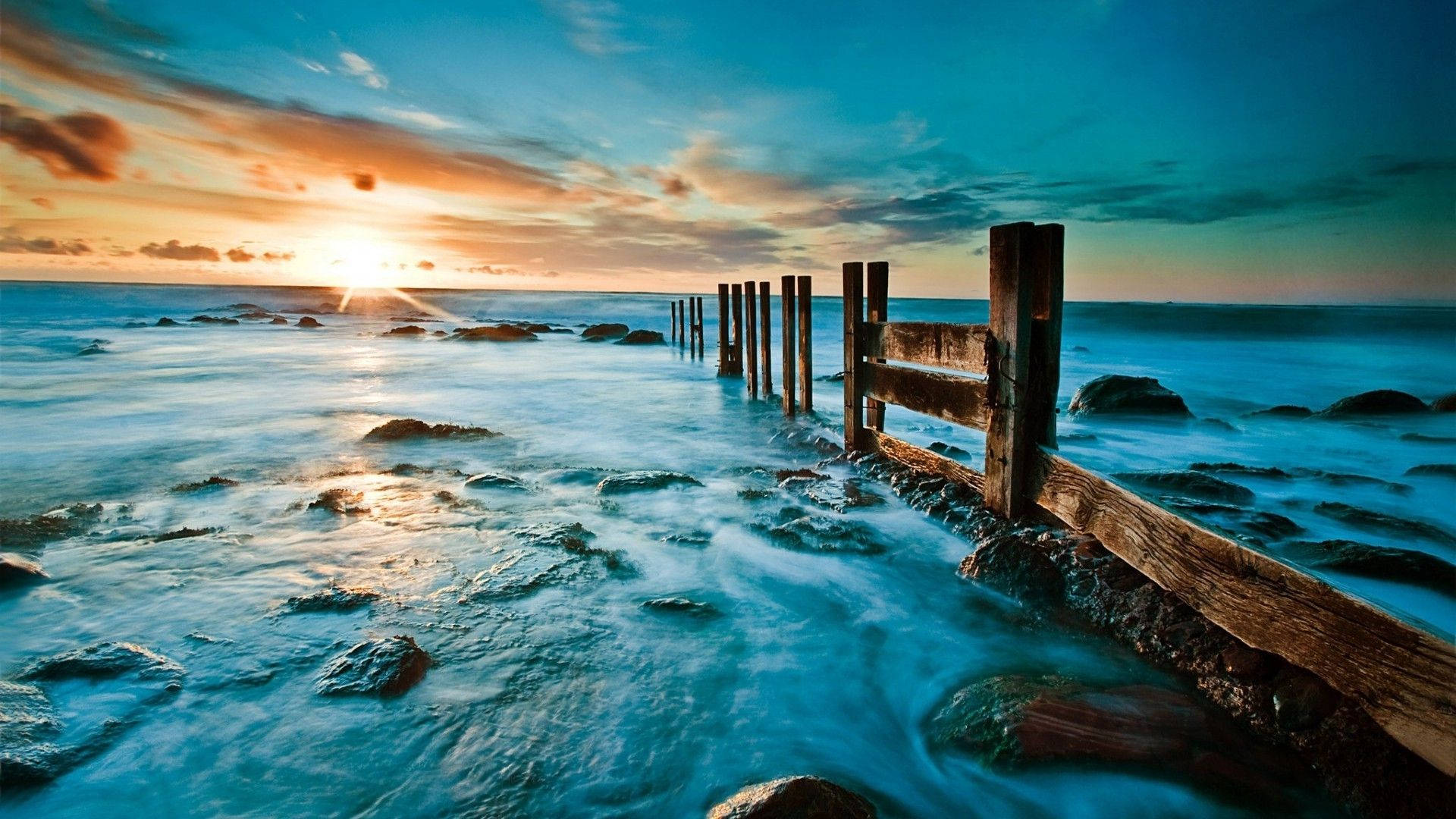 Download Caption: A Breathtaking Sky View from the Sea Wallpaper