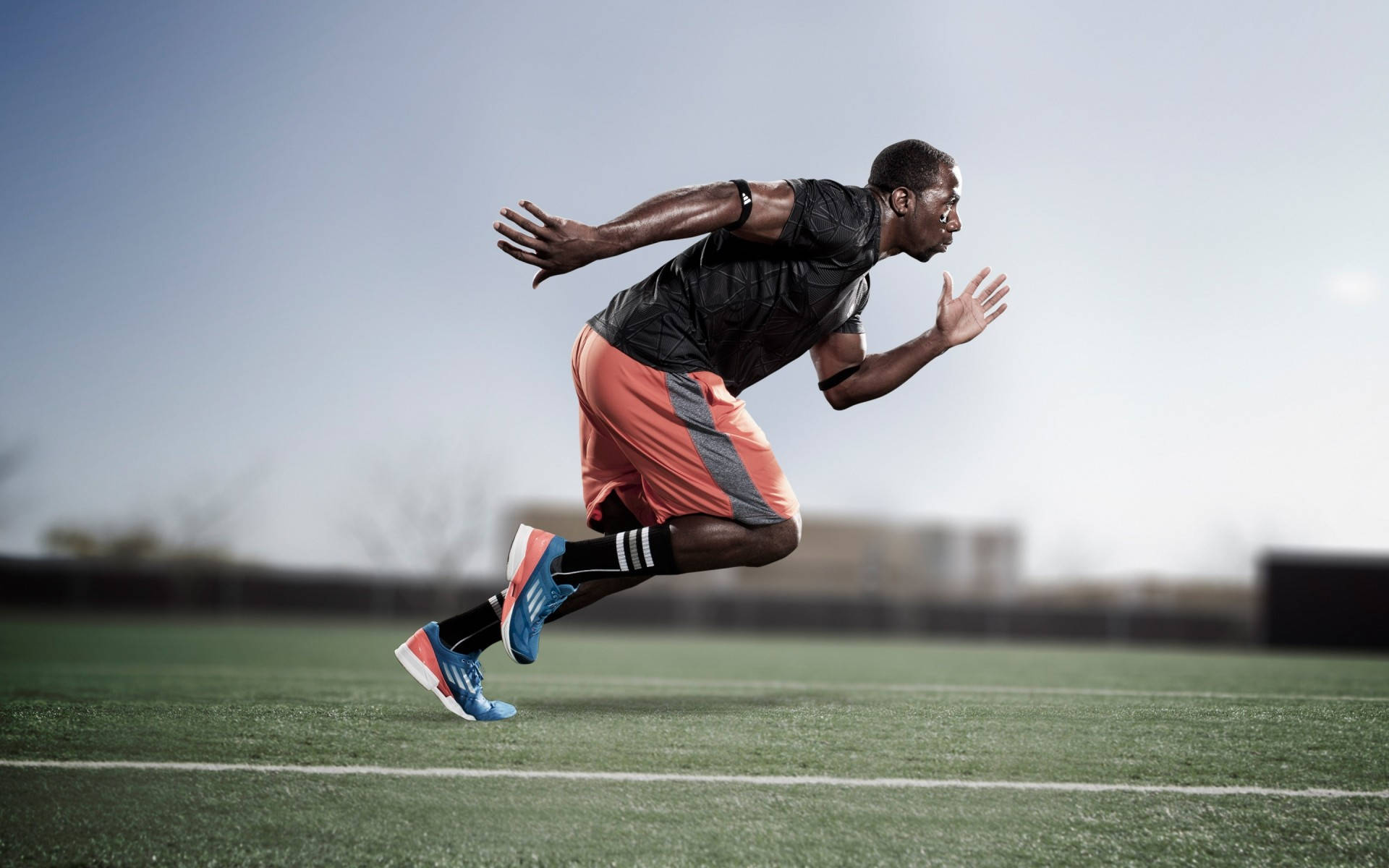 Download Running Athlete In Track And Field Wallpaper