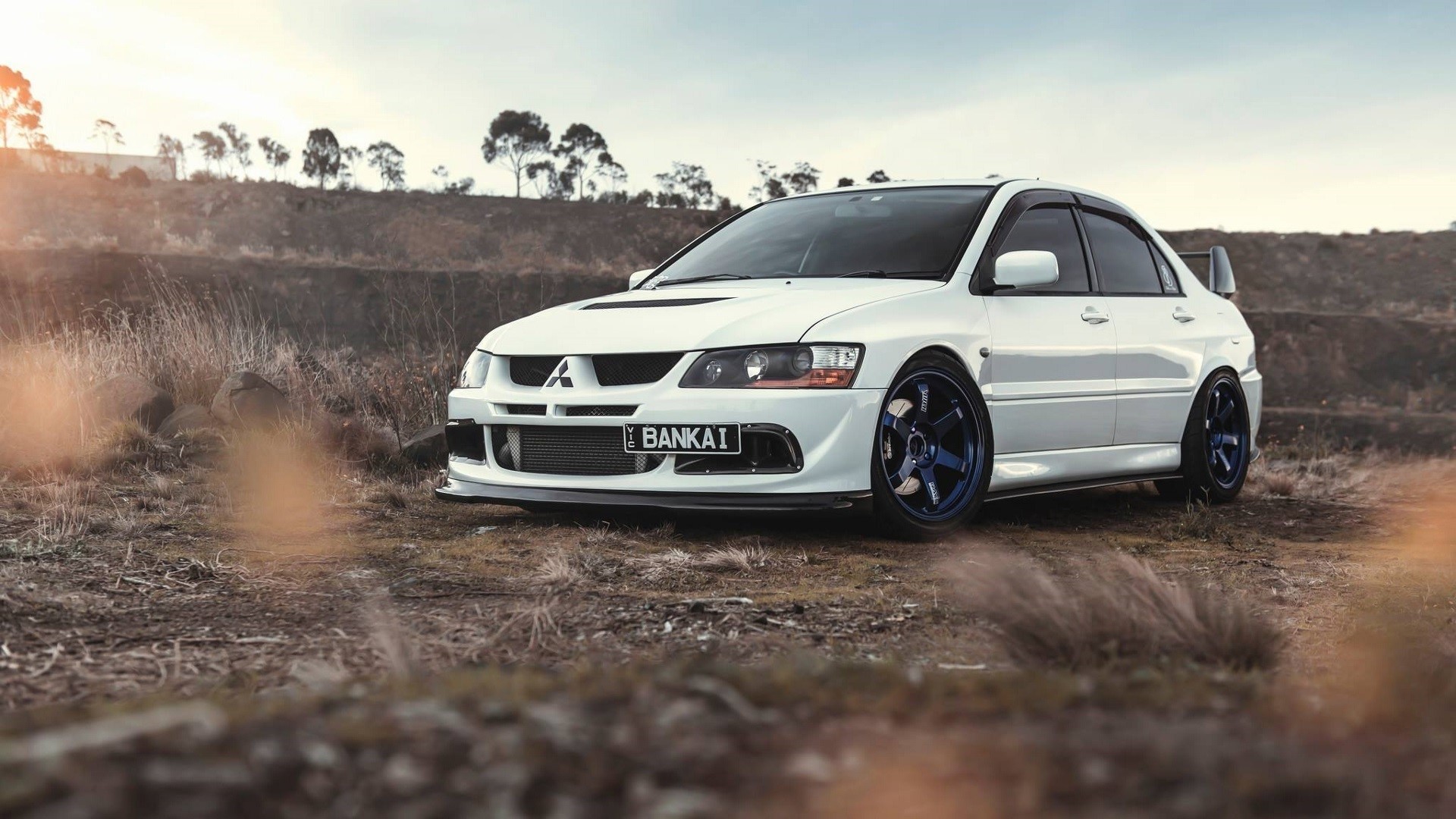 Wallpaper / Mitsubishi Lancer Evolution, Mitsubishi, JDM, Japanese cars, black cars, dirt, sunset, sports car, car, vehicle, outdoors Wallpaper