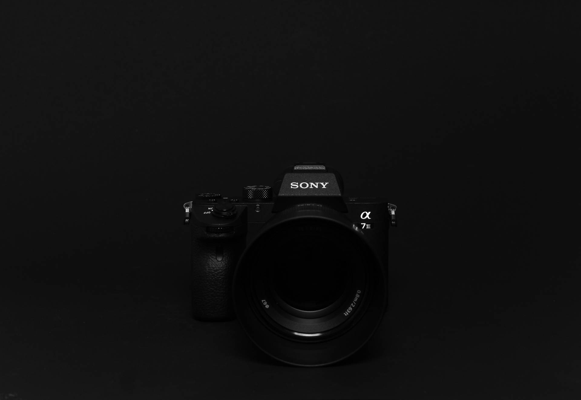 Download Sony Dslr Camera On Black Desktop Wallpaper
