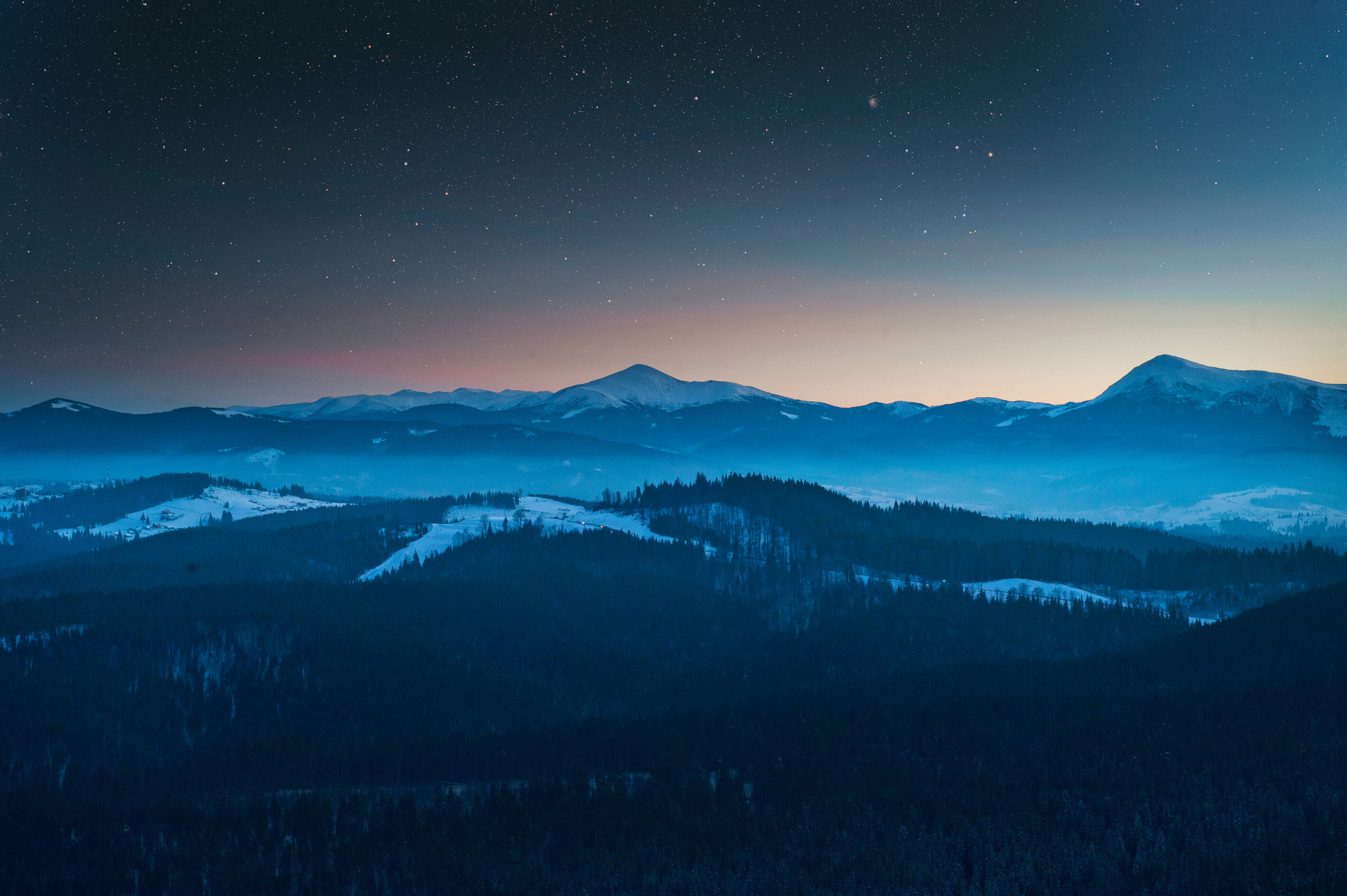 Download Blue mountain landscape beneath a night sky Wallpaper
