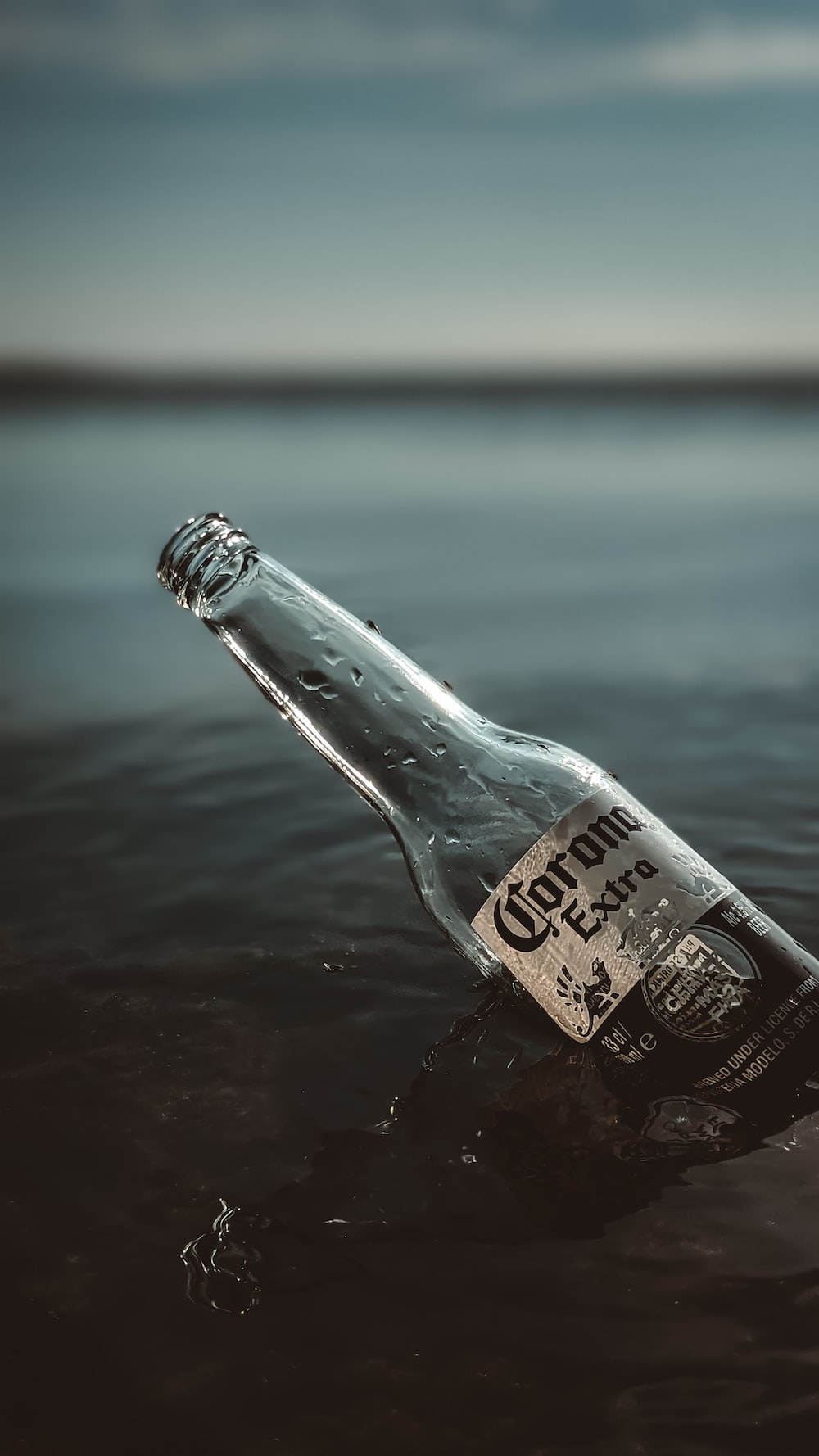 Clear glass bottle on water photo